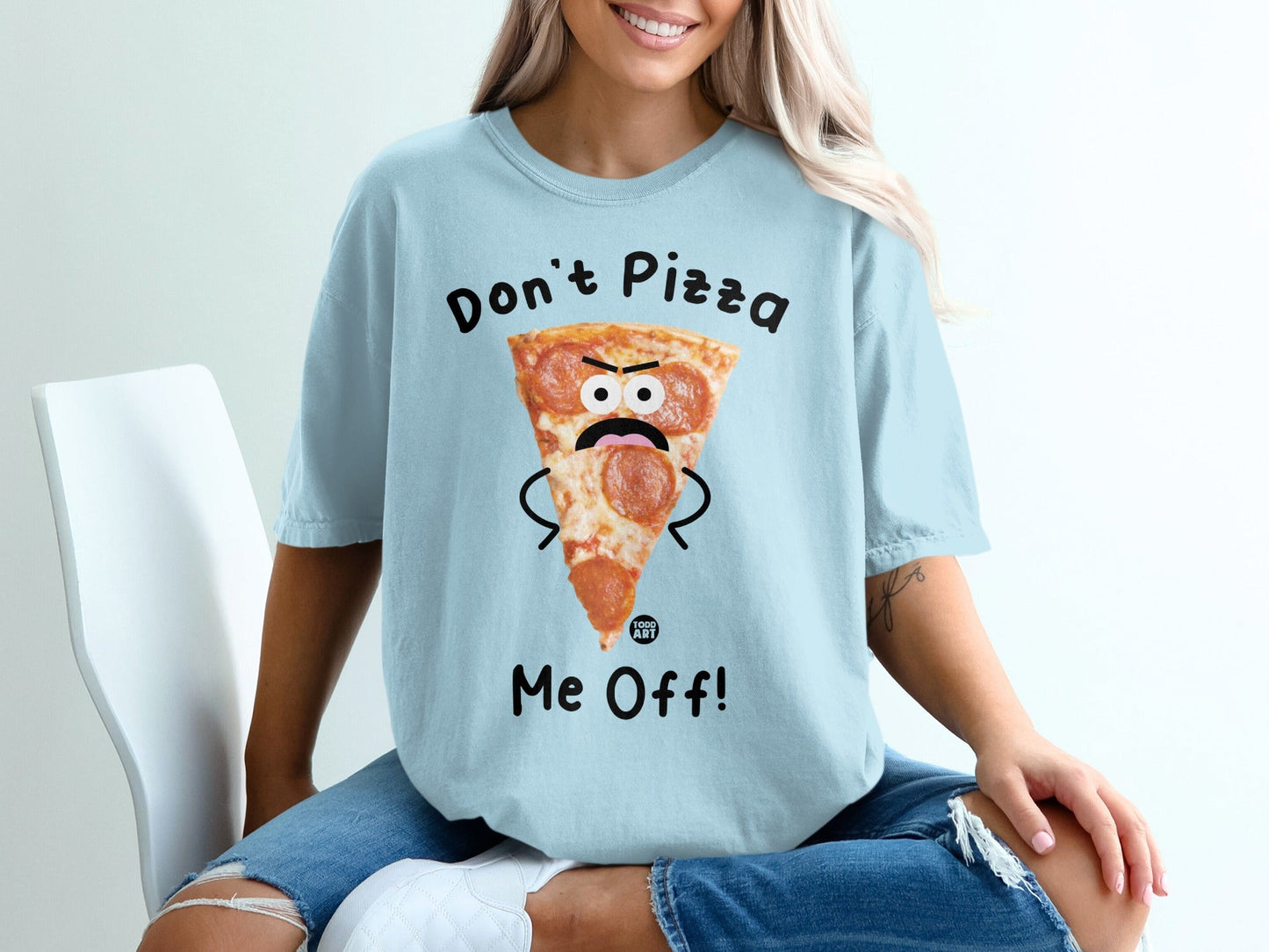 Light blue t-shirt with a cartoon pizza slice saying "Don't Pizza Me Off!"