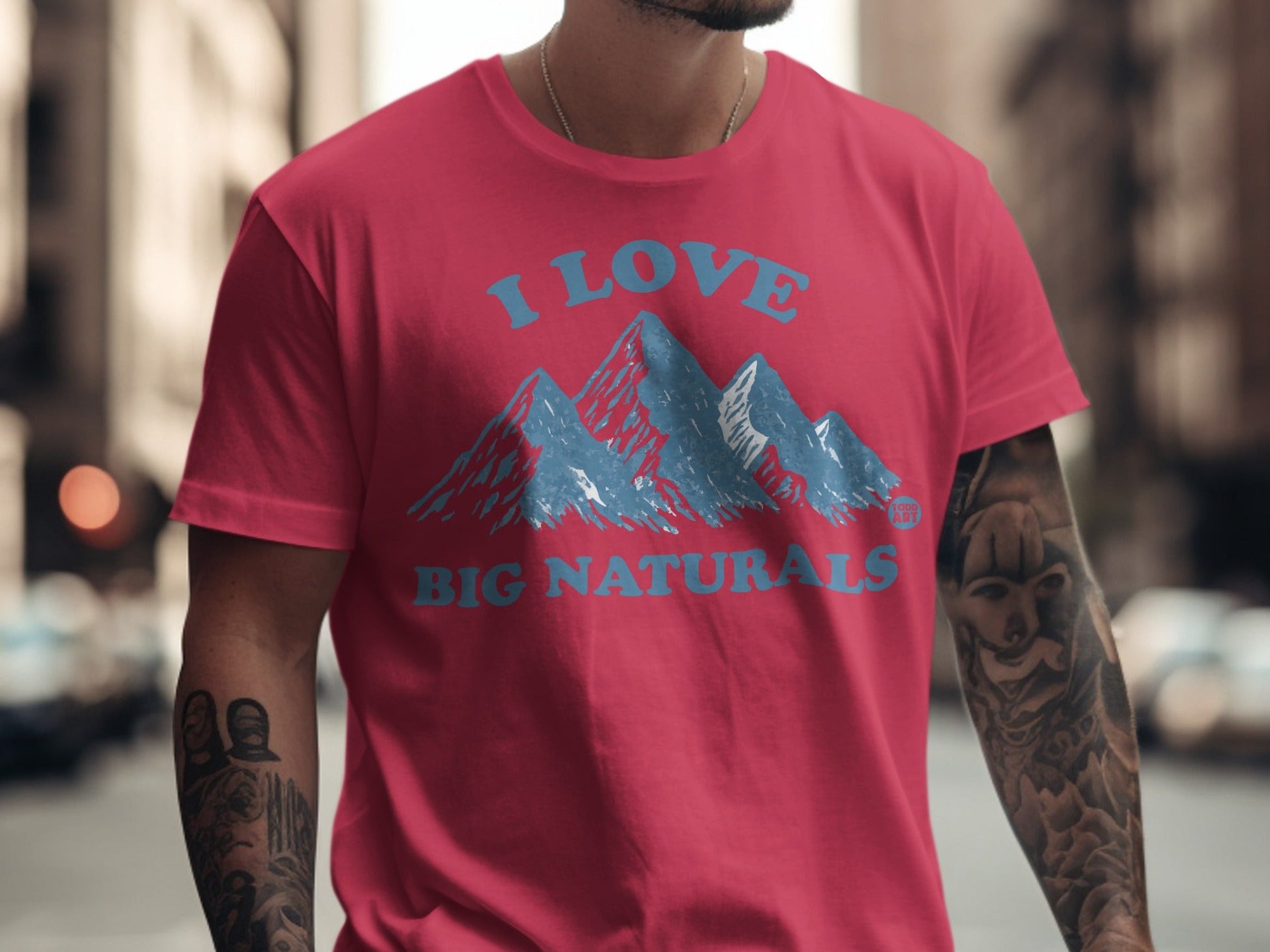 Red t-shirt with blue mountains and "I LOVE BIG NATURALS" text.