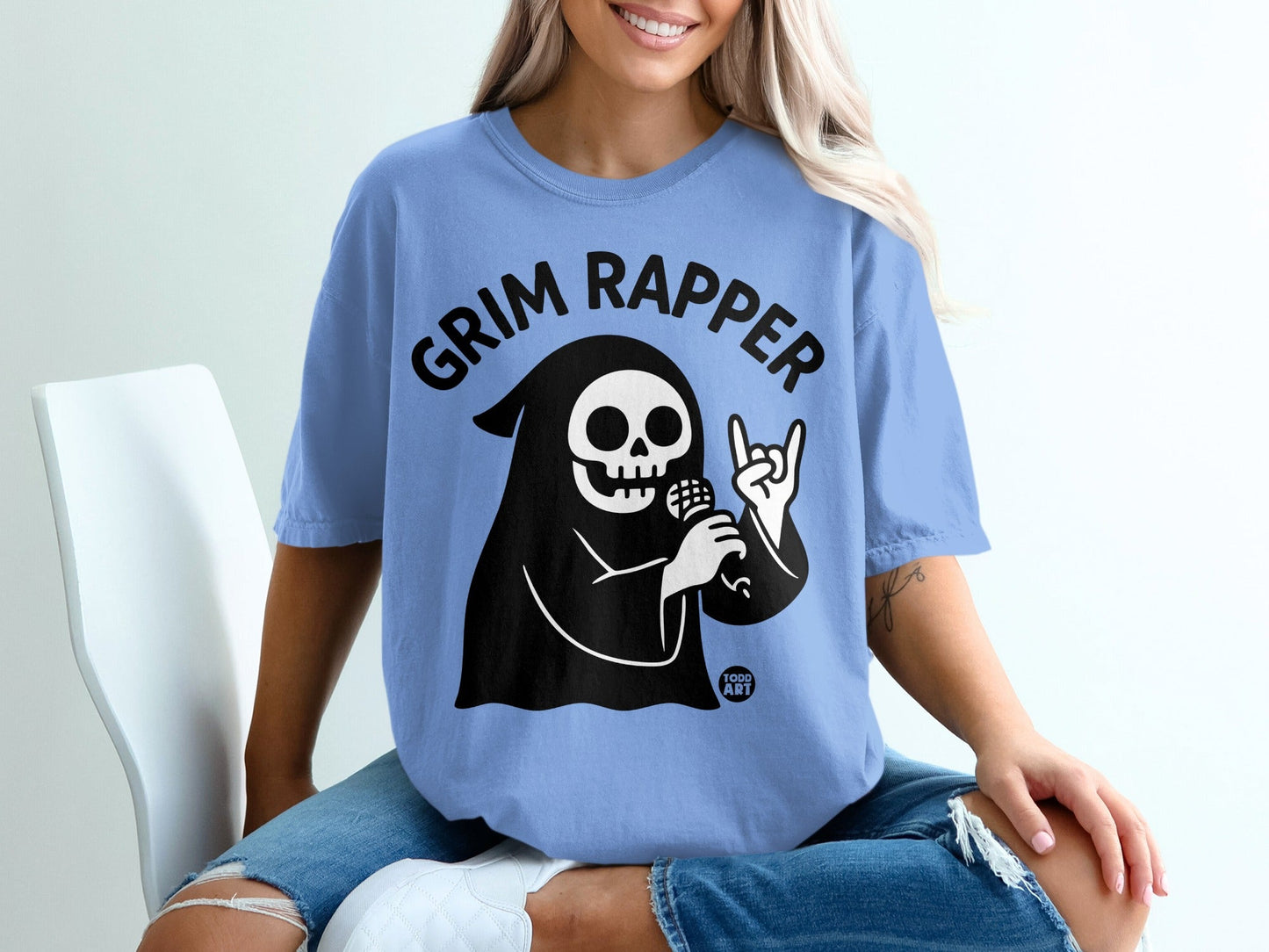 Blue t-shirt with "Grim Rapper" skull graphic and microphone.