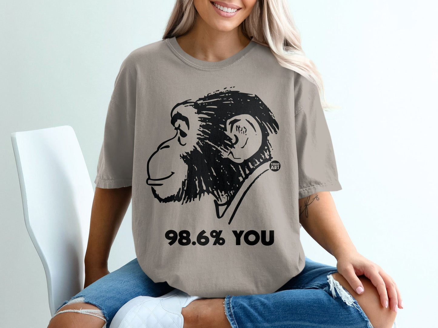 T-shirt with a black ink drawing of a chimpanzee's head and "98.6% YOU".