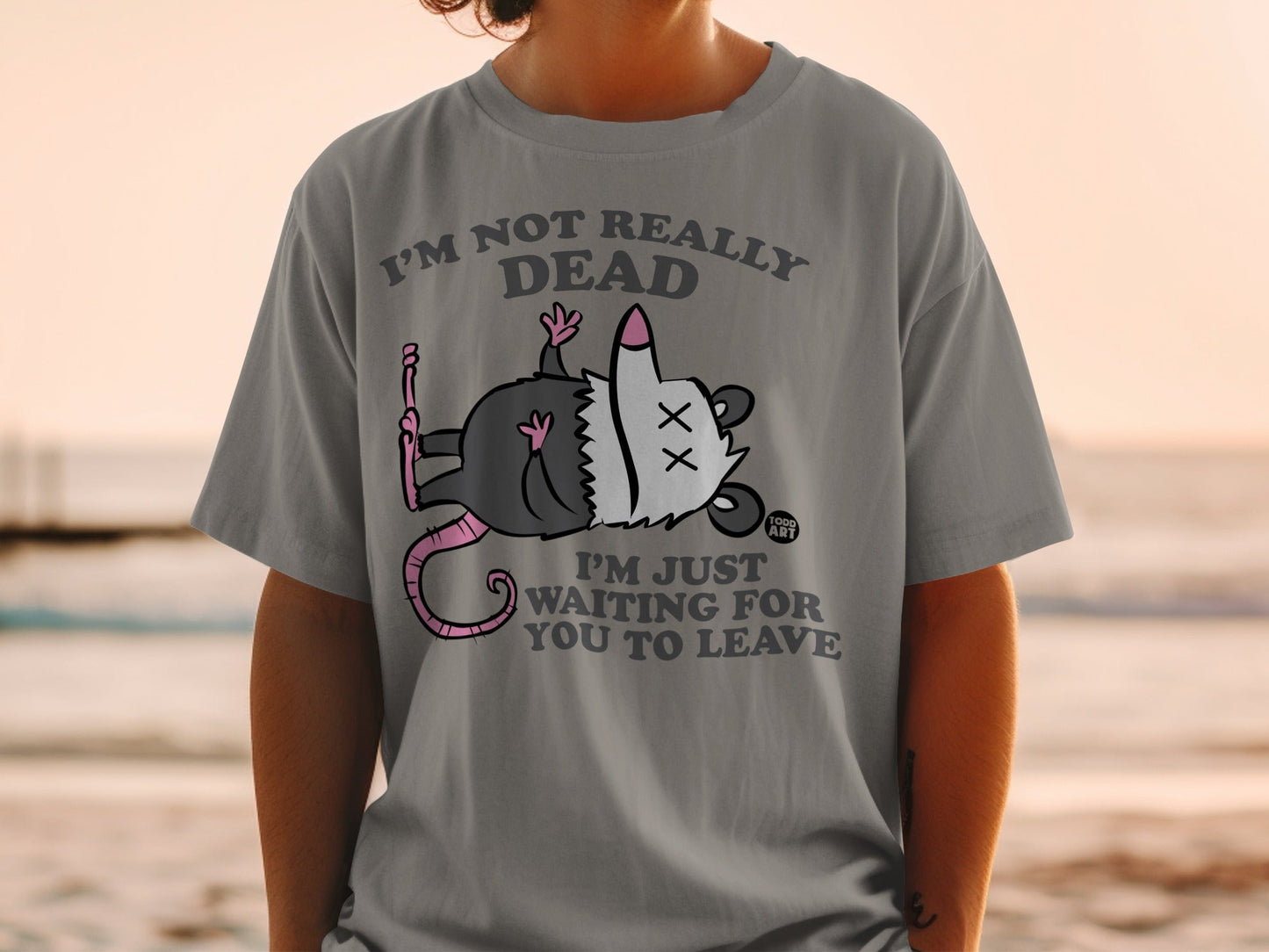 Gray t-shirt with opossum graphic and text "I'm not really dead, I'm just waiting for you to leave".
