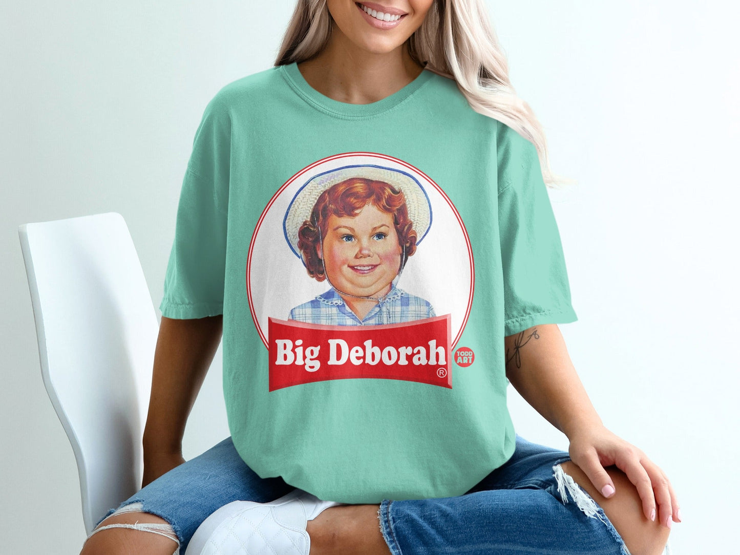 T-shirt with a circular retro graphic of a smiling child named Big Deborah.