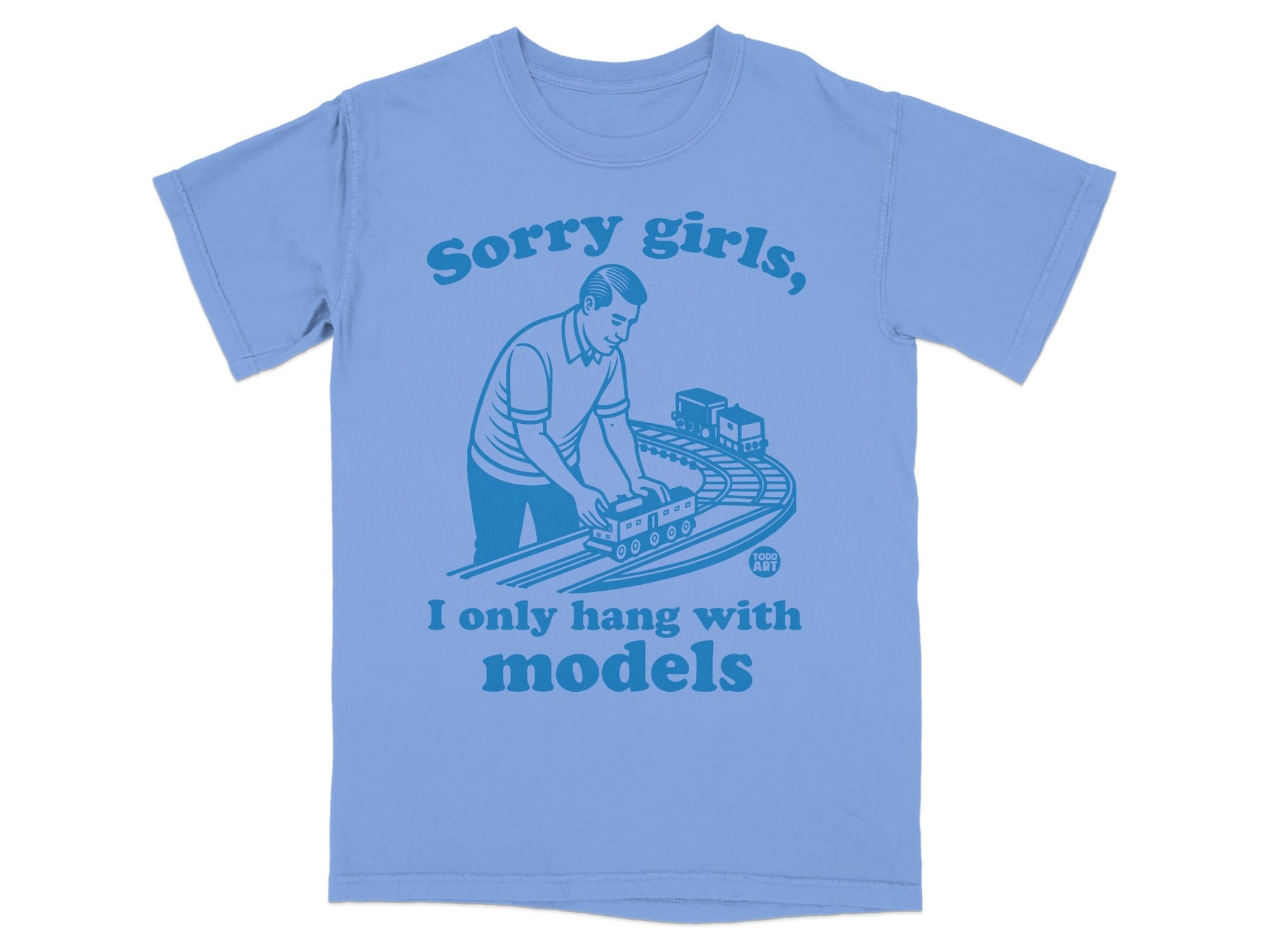 Light blue t-shirt with text: "Sorry girls, I only hang with models" and a man playing with toy trains.