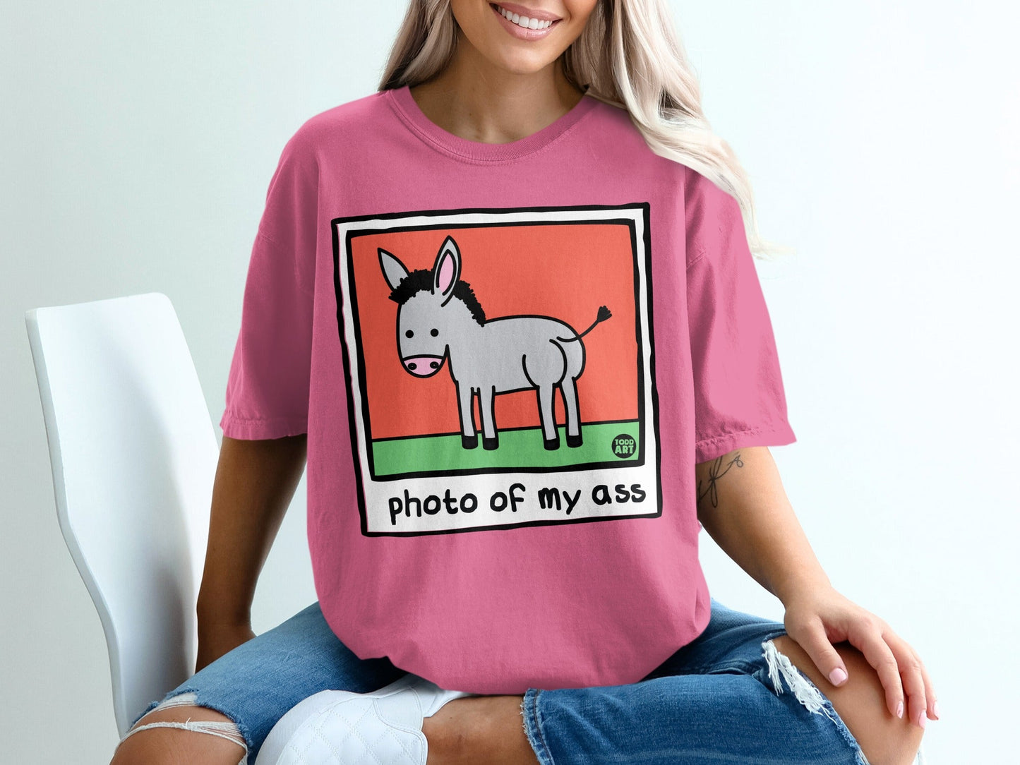 Pink t-shirt with cartoon donkey and "photo of my ass" text.