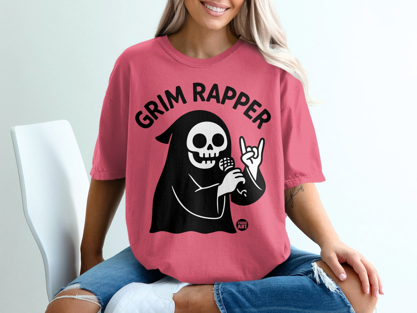 Grim Rapper graphic t-shirt featuring a skeleton in a cloak holding a microphone.