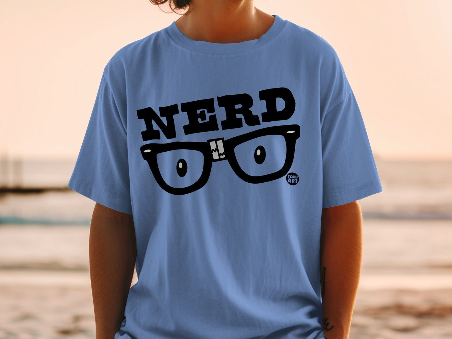 Blue t-shirt with "NERD" text and cartoon glasses graphic.