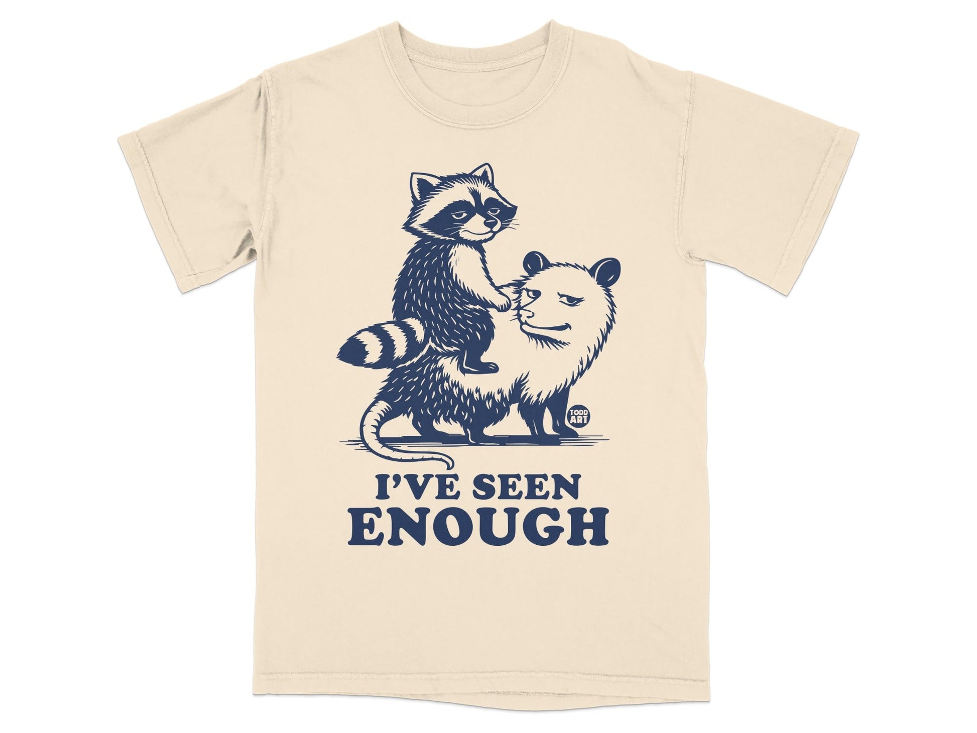 Cream t-shirt with raccoon riding an opossum and text "I'VE SEEN ENOUGH".