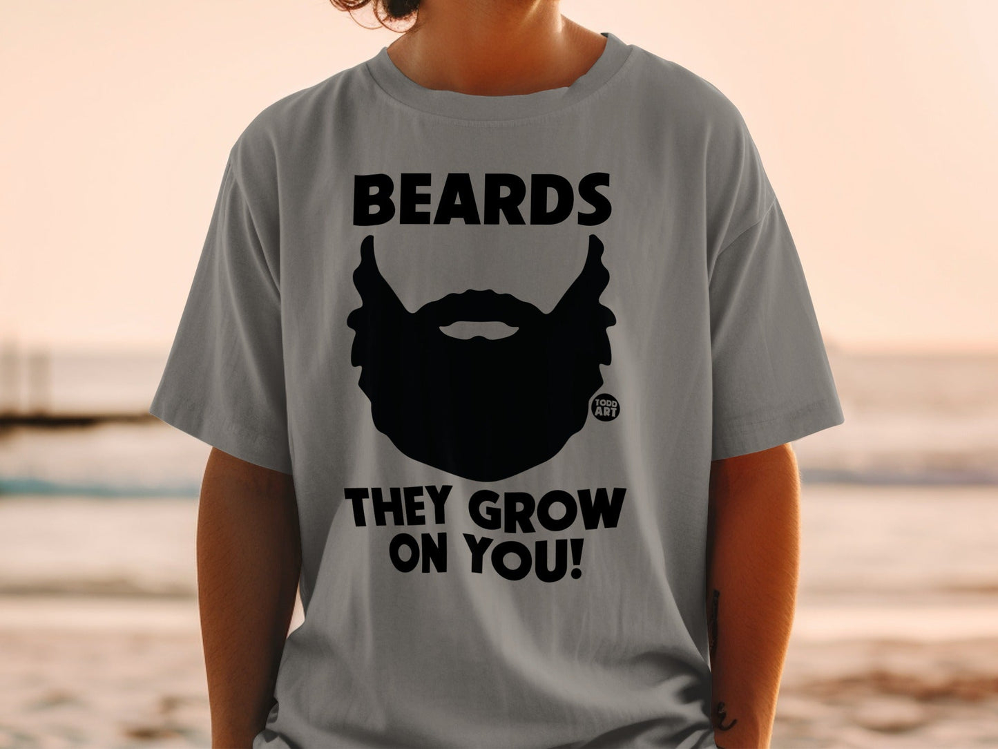 Grey t-shirt with black beard graphic and text "BEARDS THEY GROW ON YOU!".