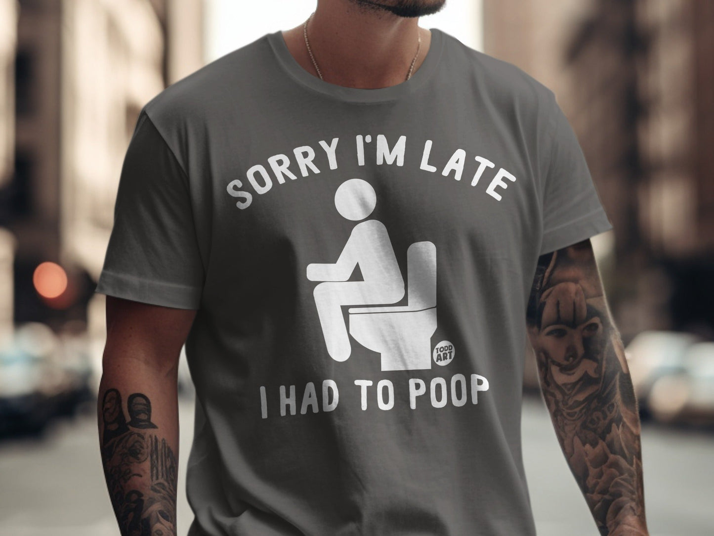 Gray t-shirt with "Sorry I'm Late I Had to Poop" text and toilet graphic.