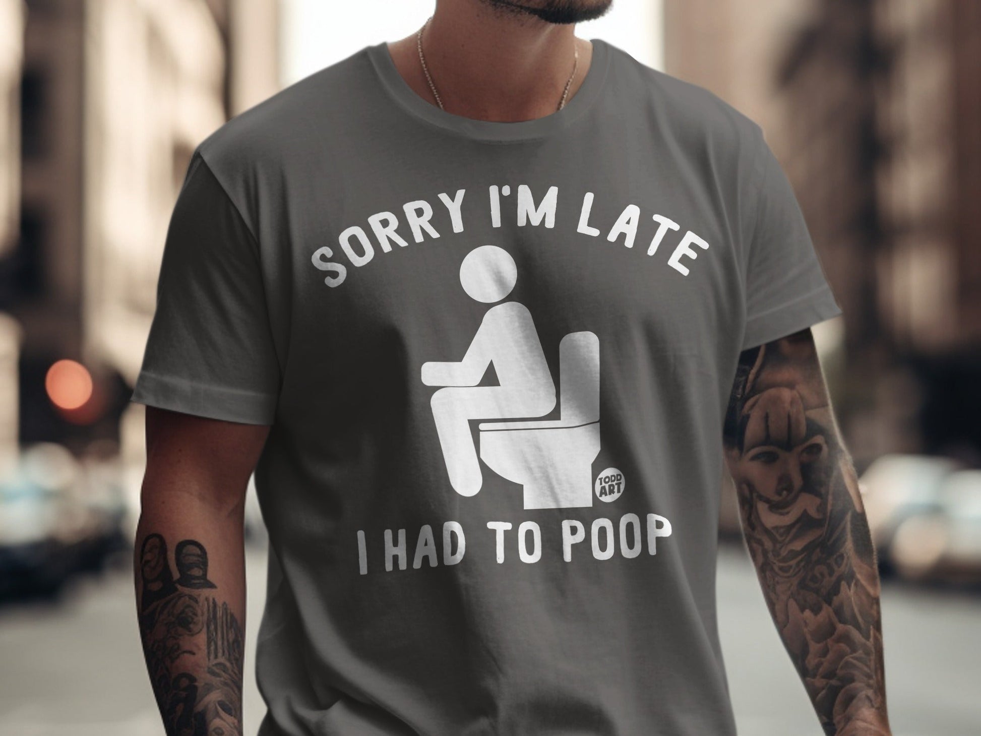 Gray t-shirt with "Sorry I'm Late I Had to Poop" text and toilet graphic.