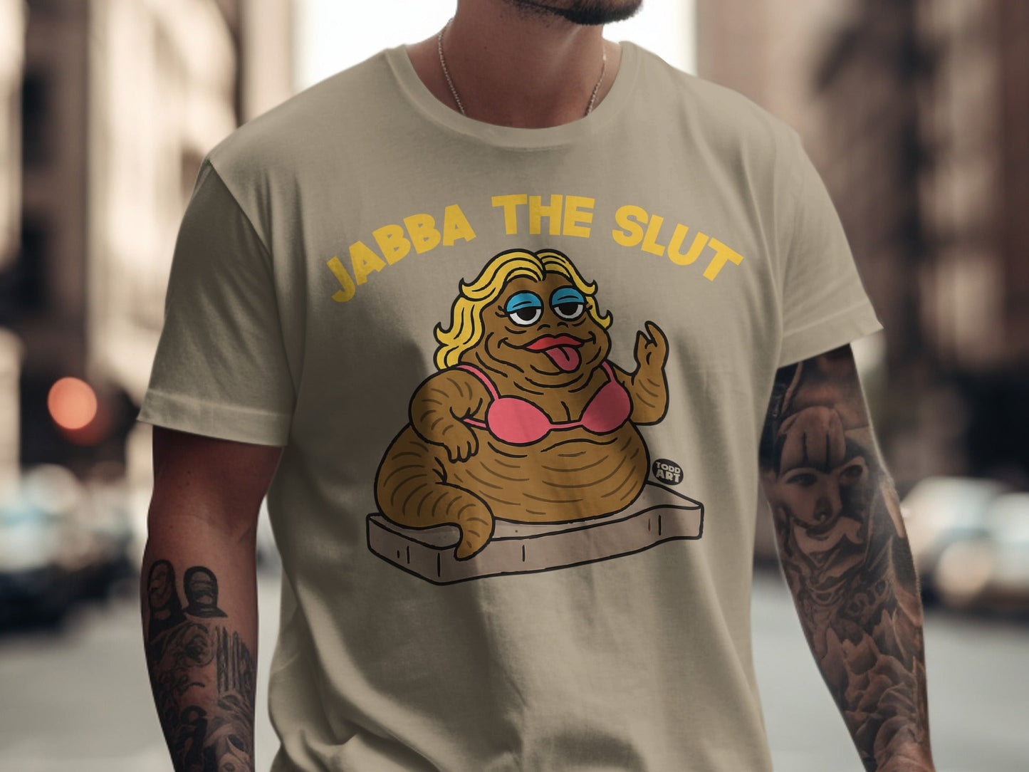 T-shirt with cartoon of a caricature labeled "JABBA THE SLUT".