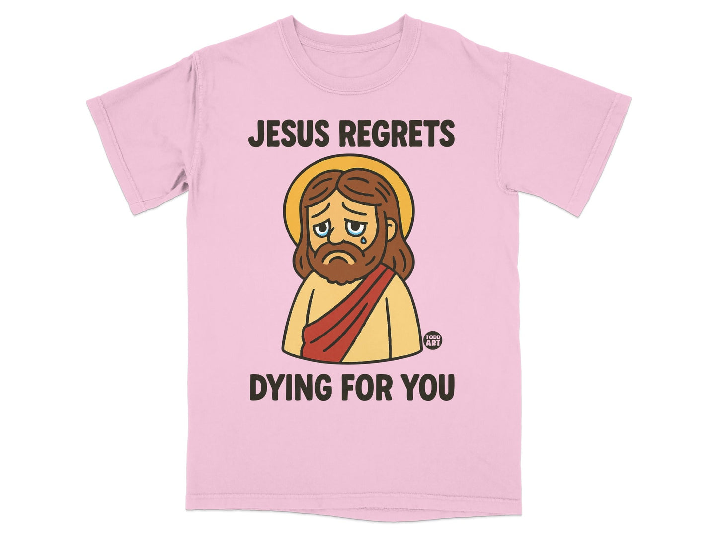 Pink t-shirt with sad Jesus graphic and text "JESUS REGRETS DYING FOR YOU".