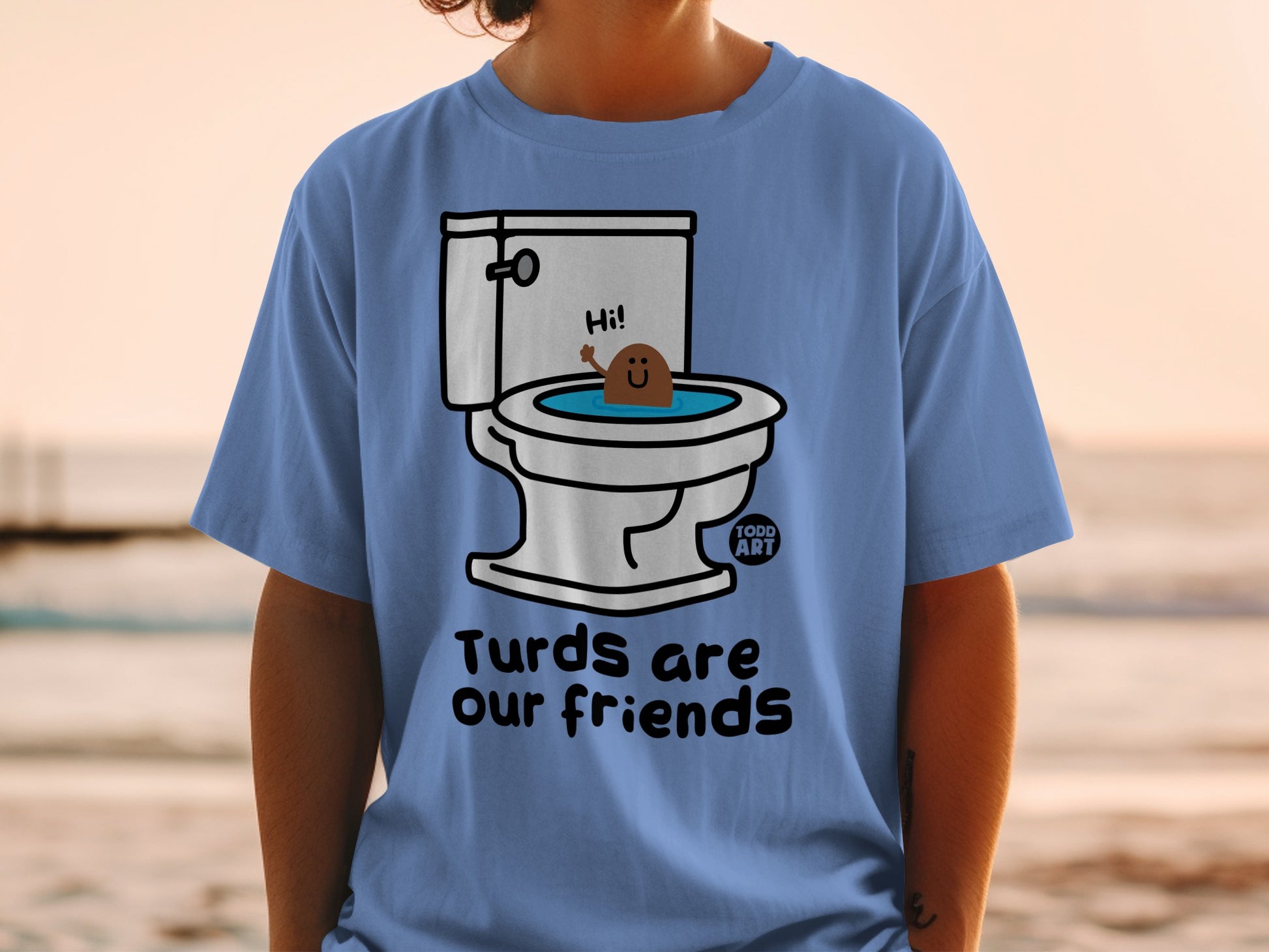 Blue t-shirt with cartoon poop saying "Hi!" from a toilet, text "Turds are our friends".