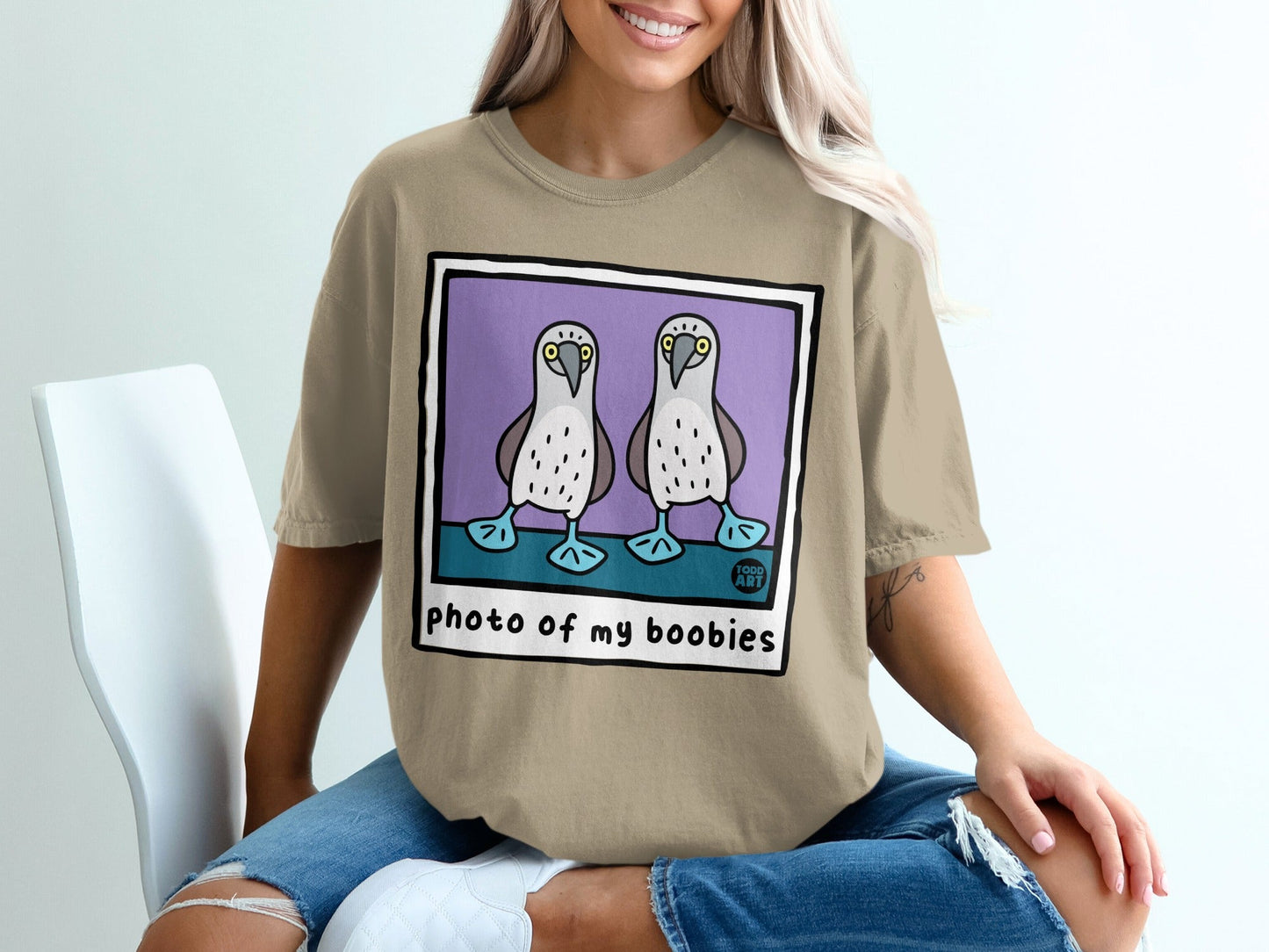 T-shirt with illustration of two boobies and text "photo of my boobies".