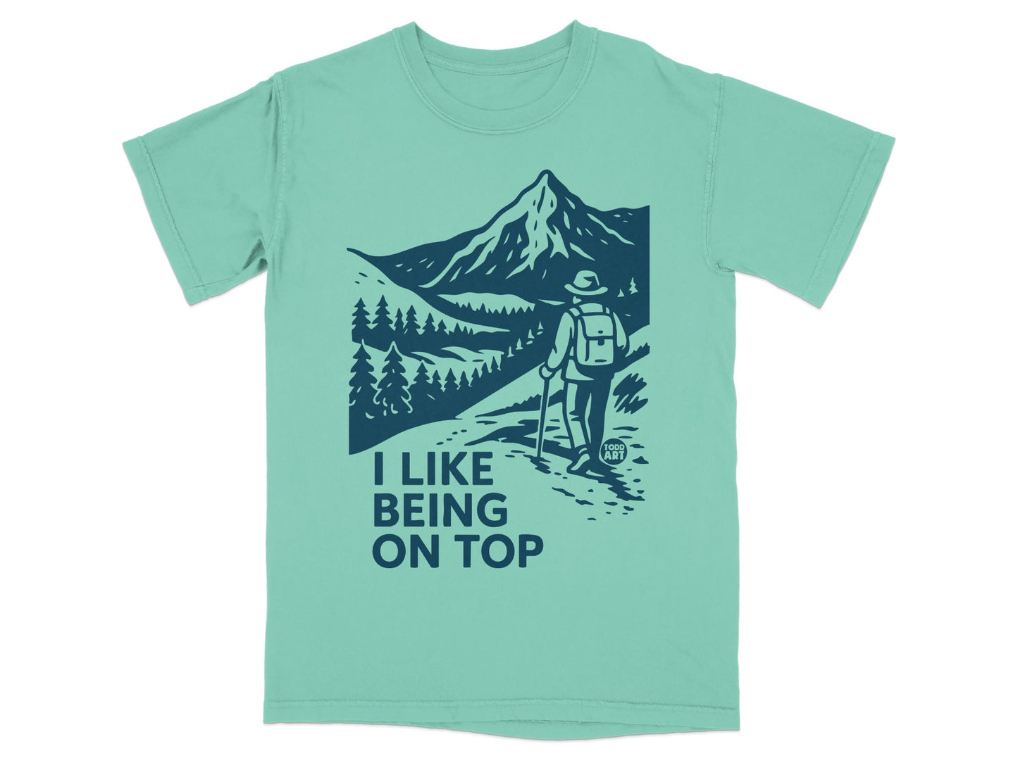 T-shirt with "I like being on top" text and hiker on mountain.