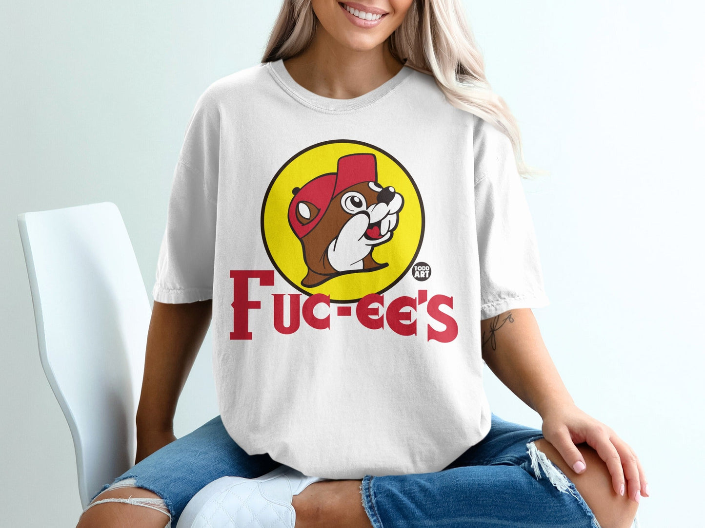 White t-shirt with Buc-ee's beaver logo and text.