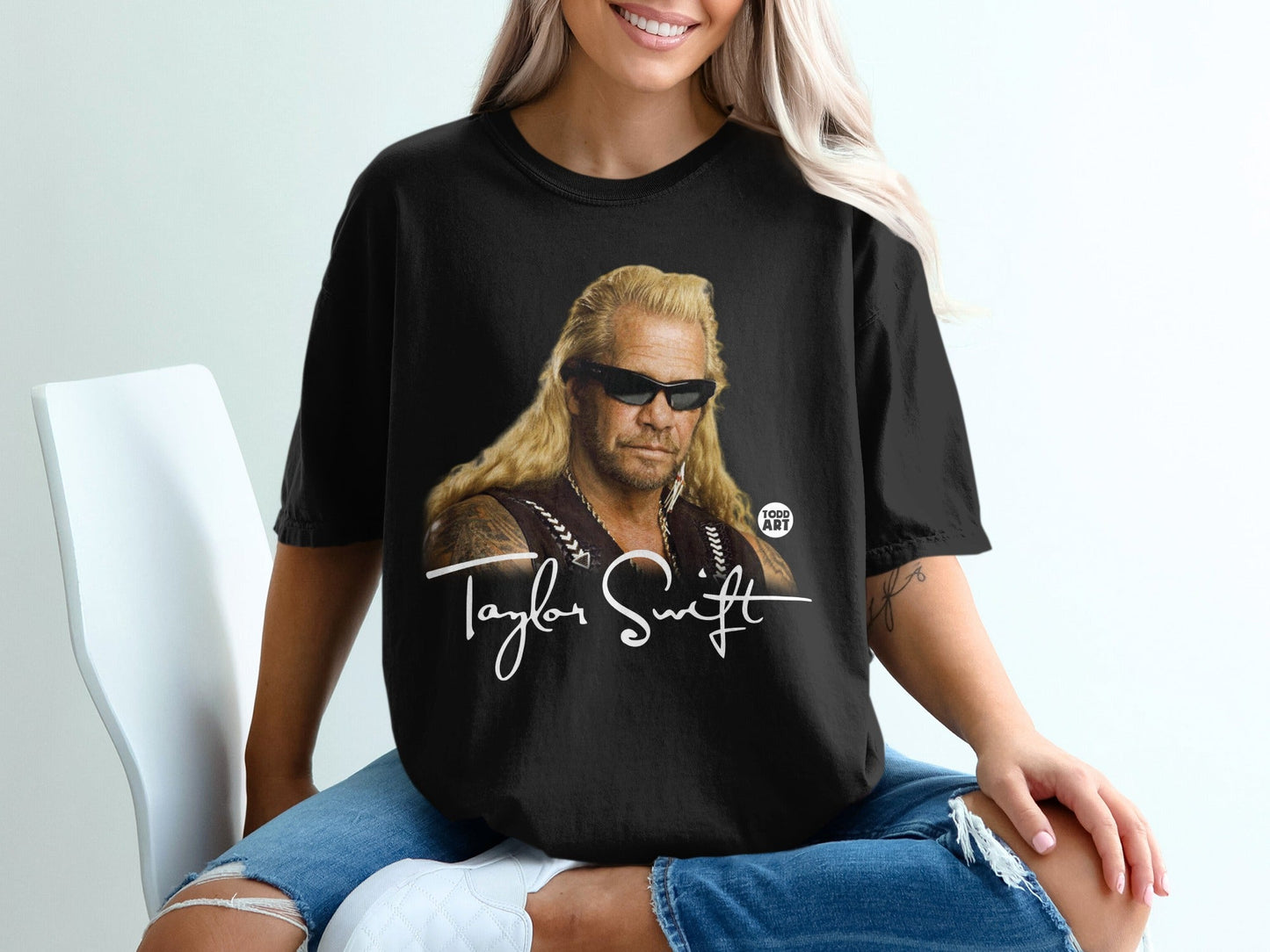 Black t-shirt with "Taylor Swift" and Dog the Bounty Hunter graphic.