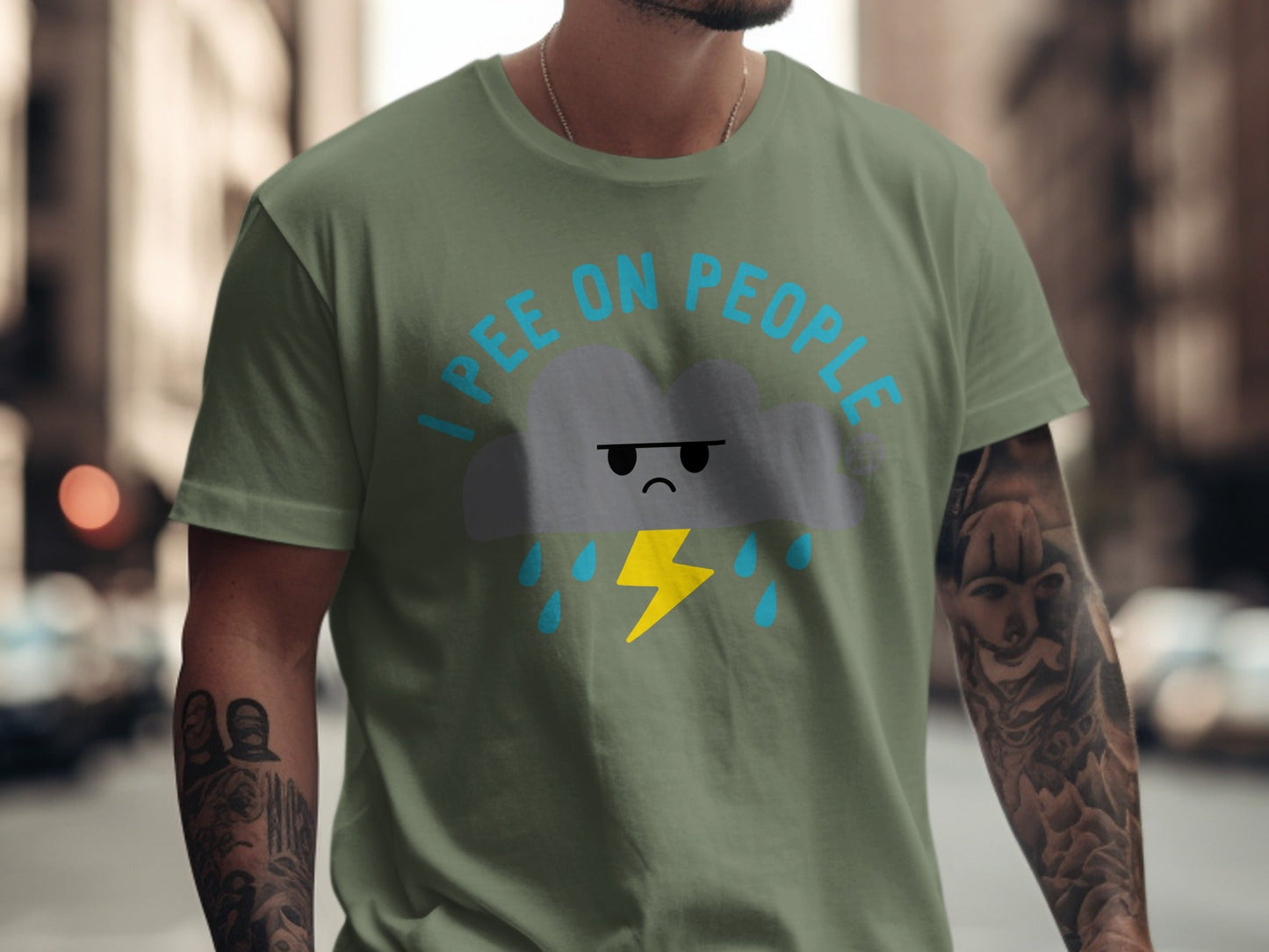 Green t-shirt with a cartoon cloud raining and a lightning bolt, text "I PEE ON PEOPLE".