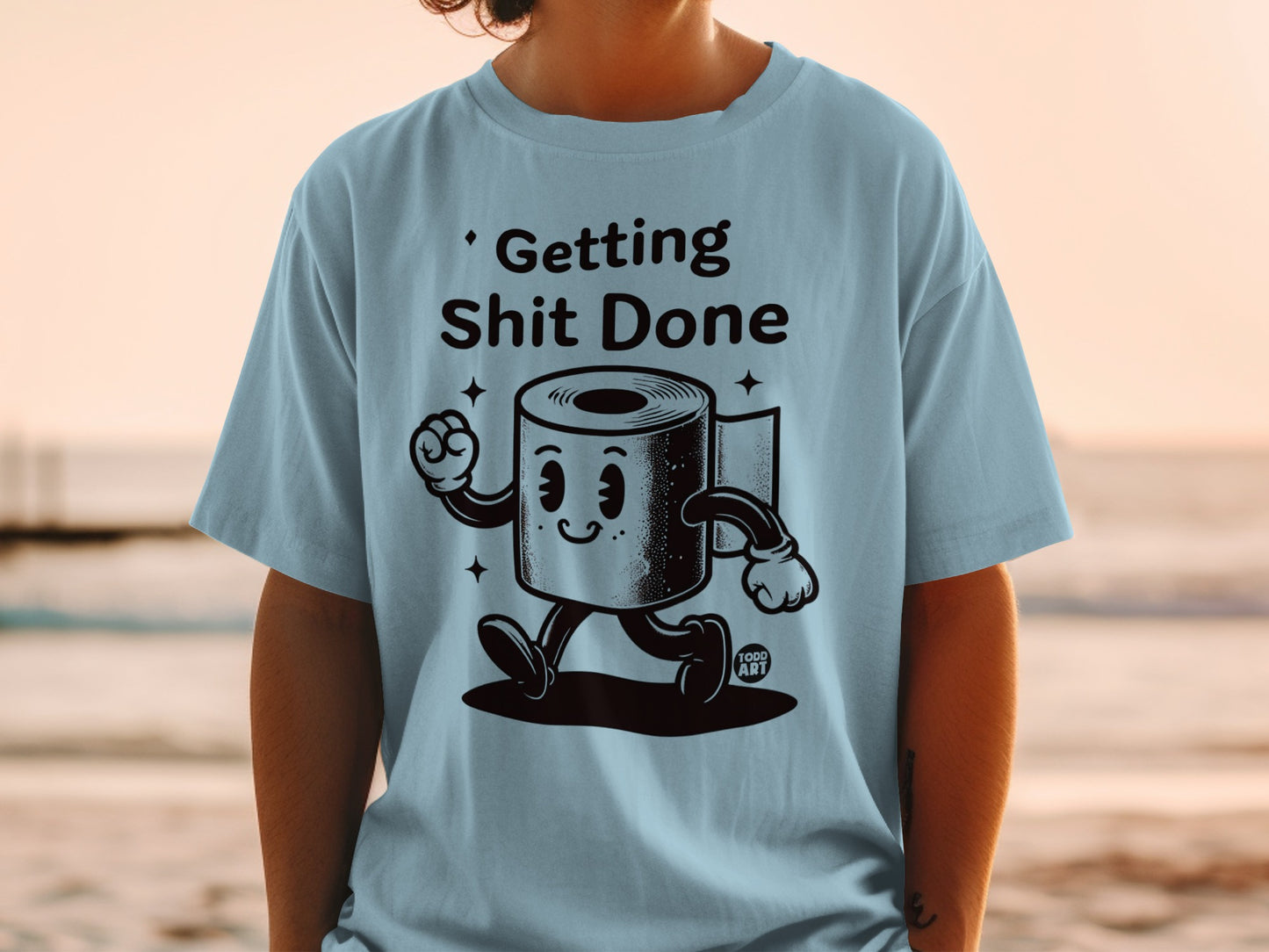 Light blue t-shirt with cartoon toilet paper character saying "Getting Shit Done."