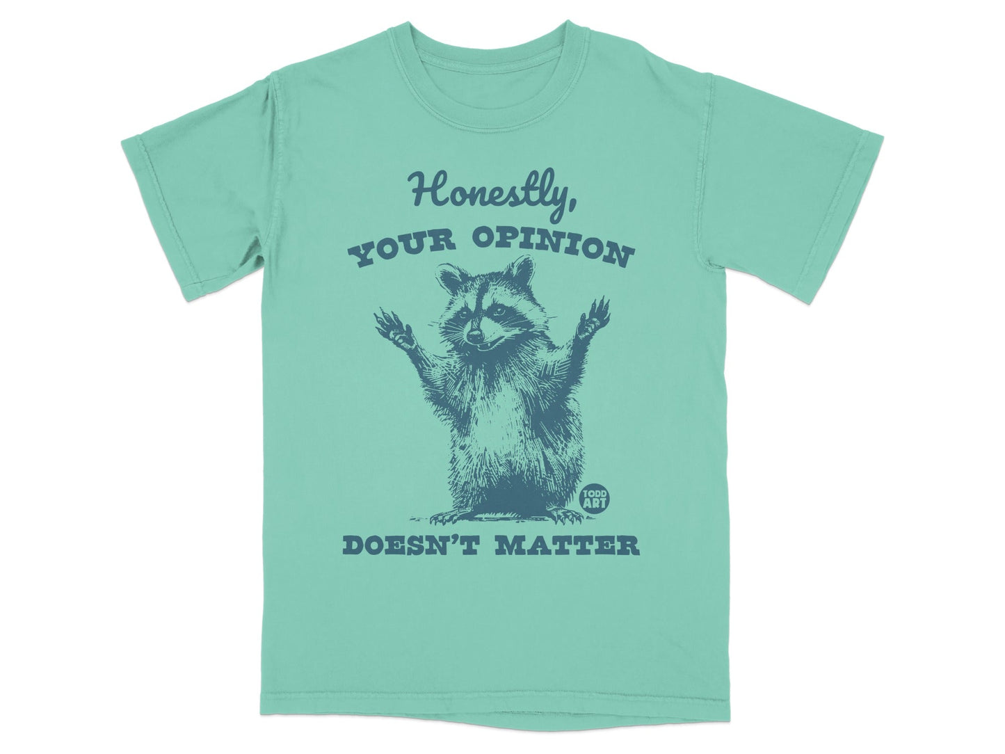 T-shirt graphic: raccoon with arms raised, text "Honestly, your opinion doesn't matter."