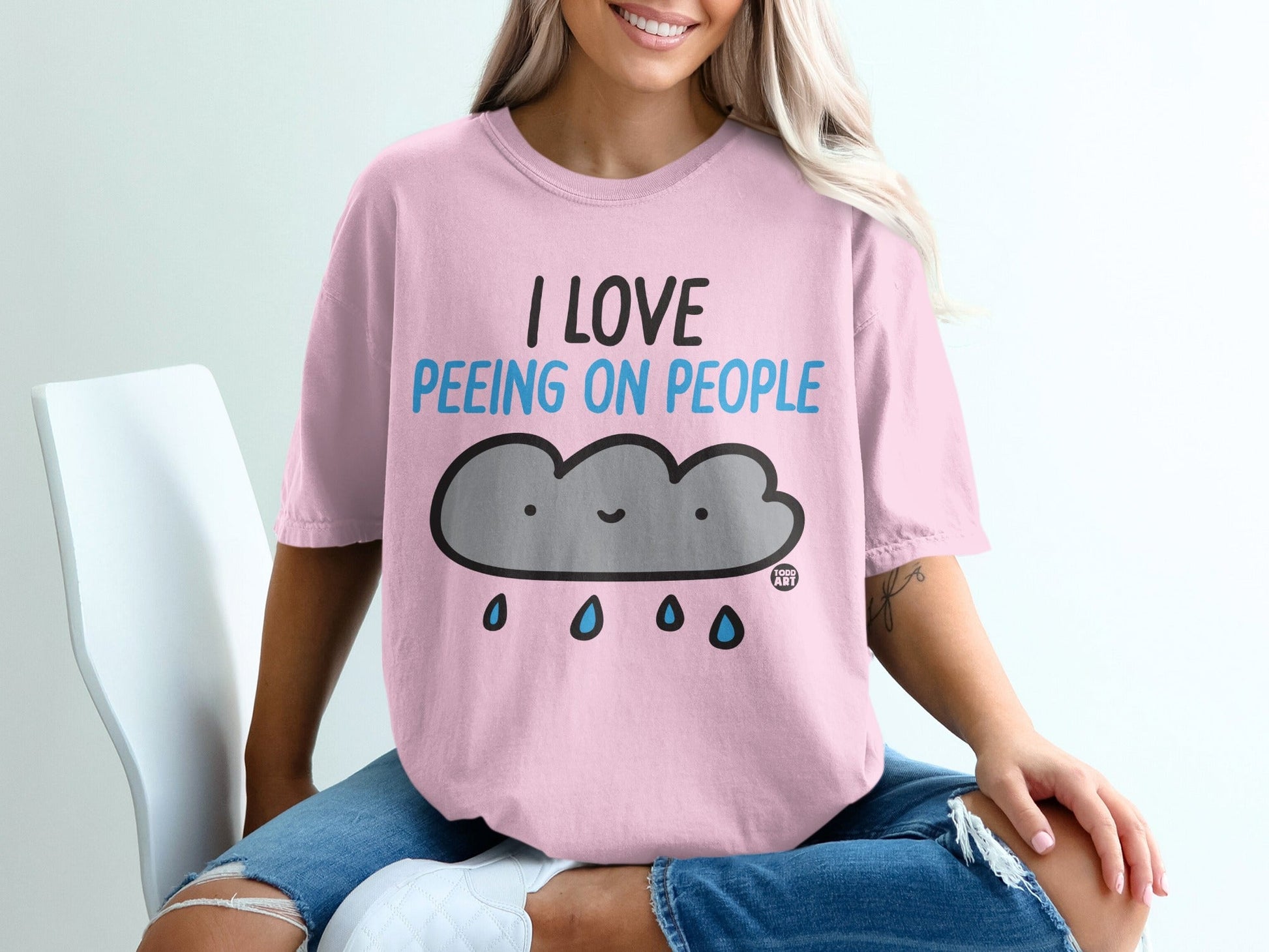 Pink t-shirt with "I LOVE PE-ing ON PEOPLE" and a smiling cloud with raindrops.