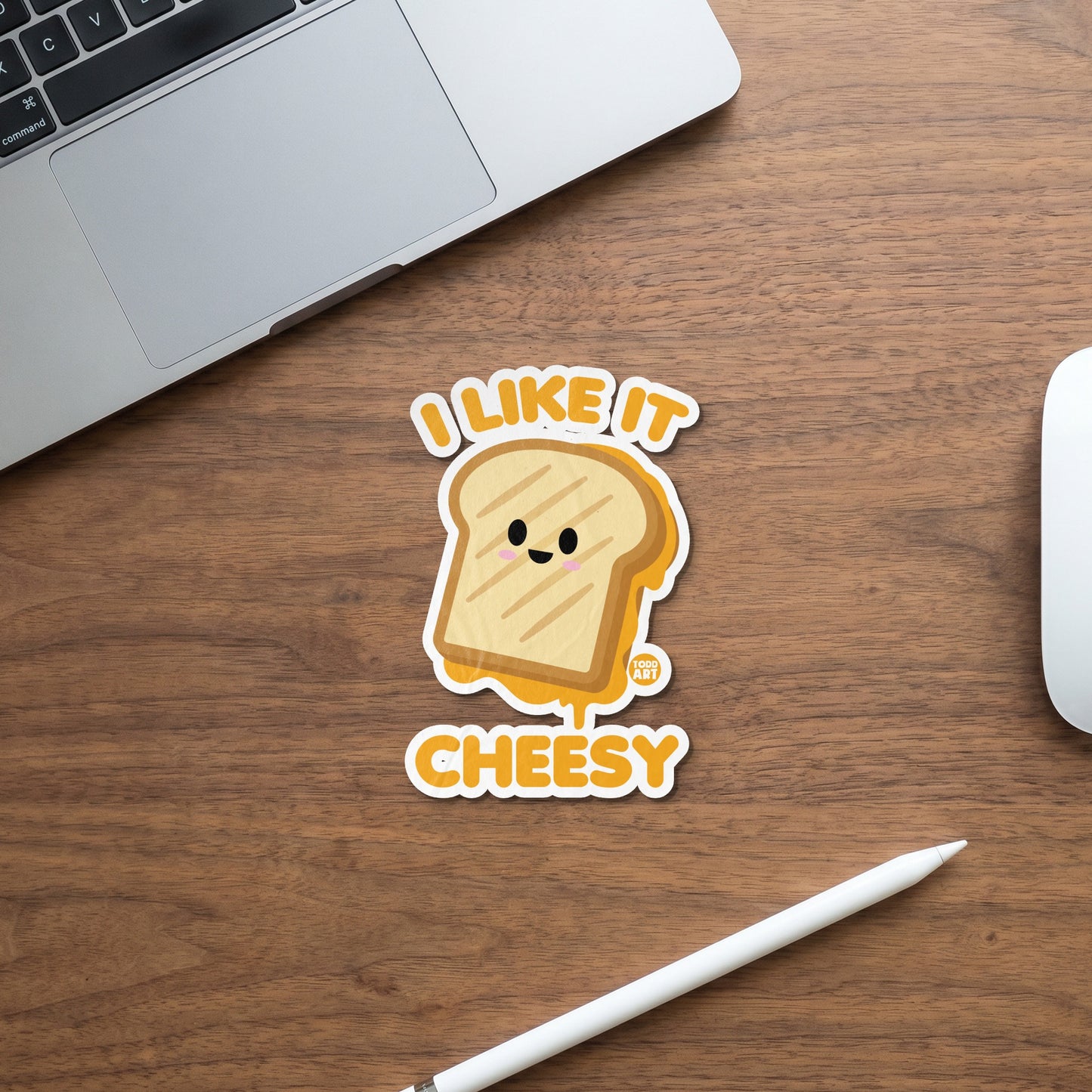 "I Like It Cheesy" sticker featuring a smiling grilled cheese sandwich with melted cheese.