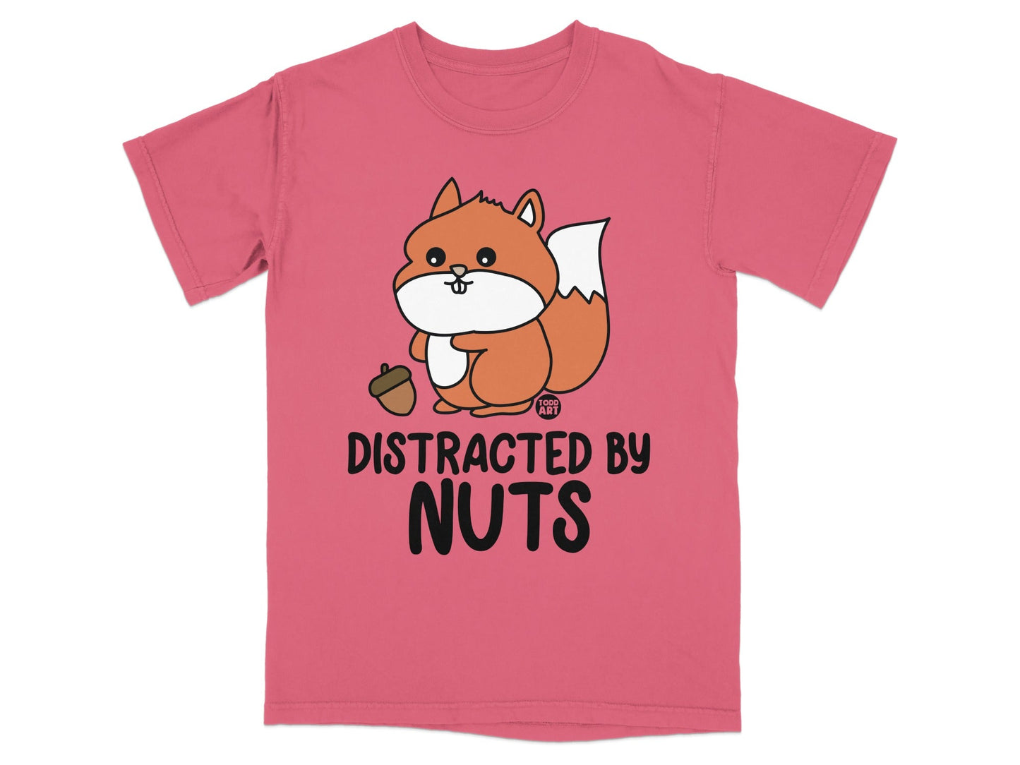 Pink t-shirt with cartoon squirrel holding acorn, text says "DISTRACTED BY NUTS".