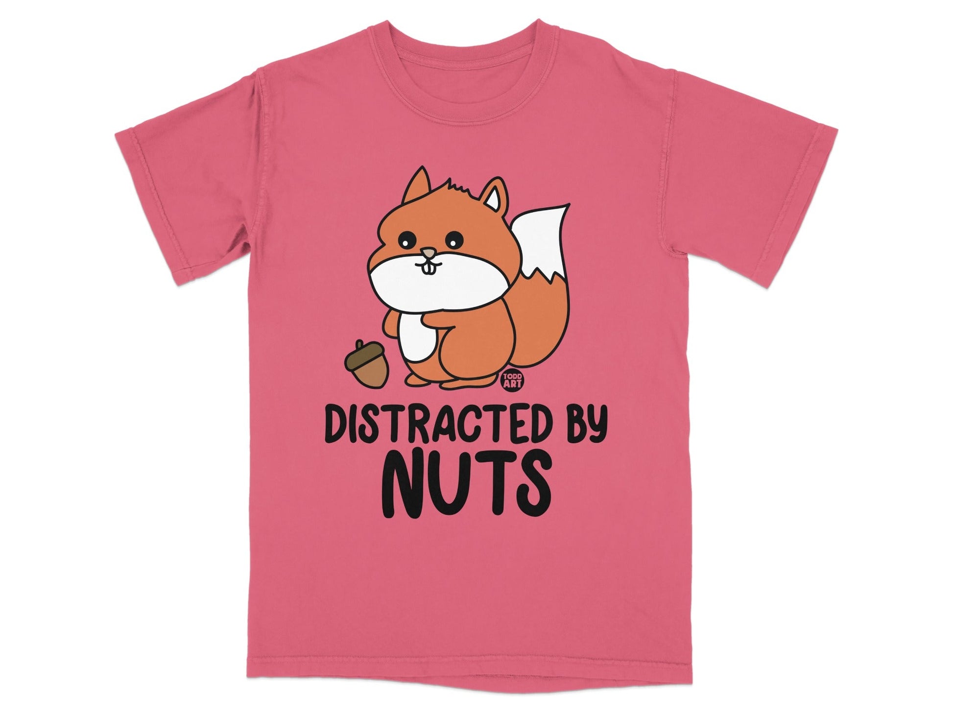 Pink t-shirt with cartoon squirrel holding acorn, text says "DISTRACTED BY NUTS".