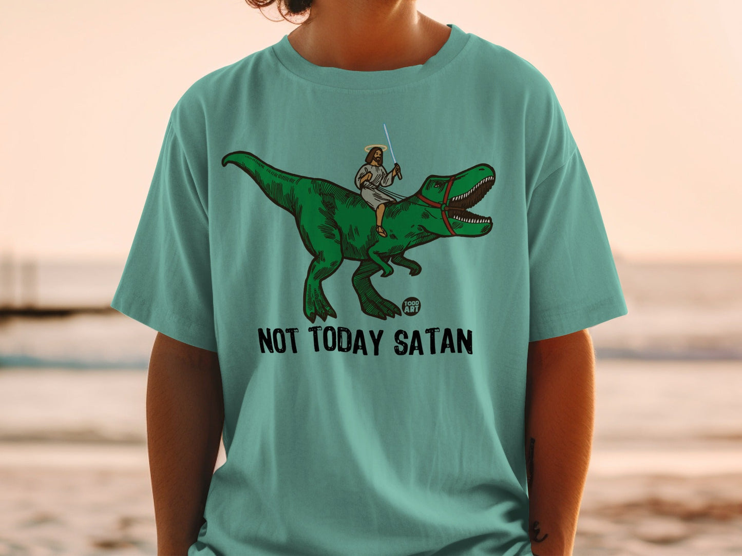 Jesus riding a T-Rex, holding a lightsaber, with text "NOT TODAY SATAN".
