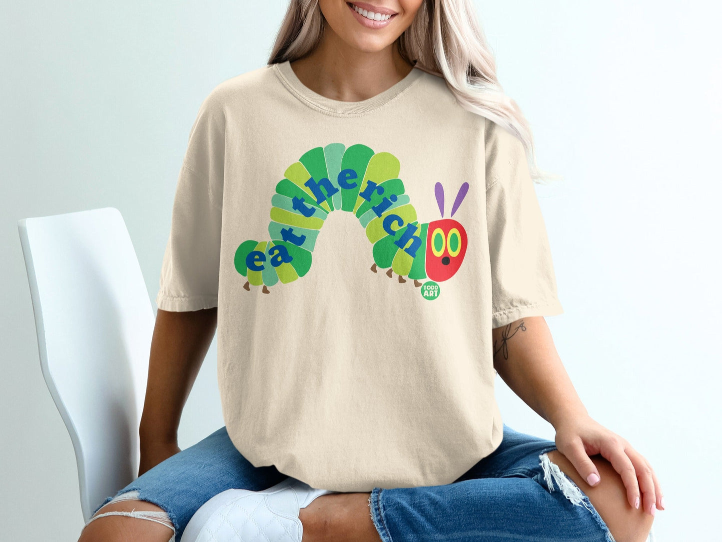 T-shirt with "Eat the Rich" text art in a caterpillar design.