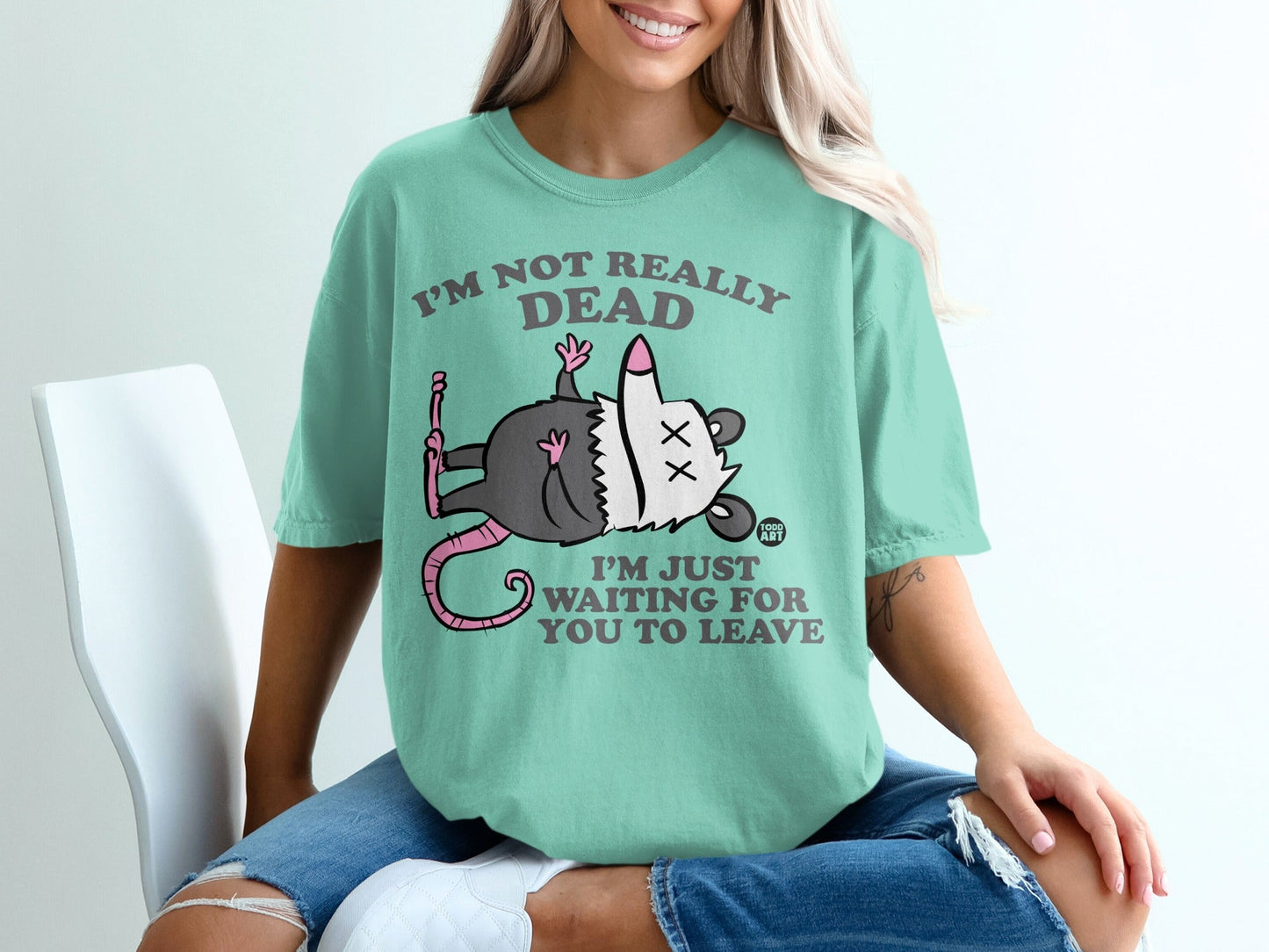 Opossum graphic t-shirt with "I'm not really dead, I'm just waiting for you to leave" text.