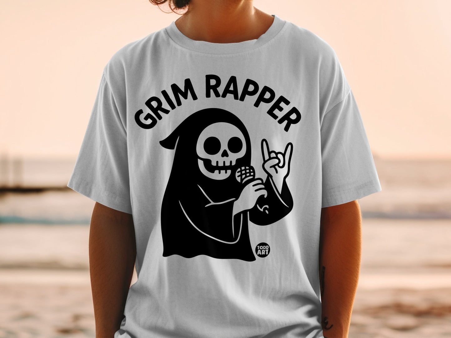 Grim Reaper graphic on a white t-shirt with "GRIM RAPPER" text.