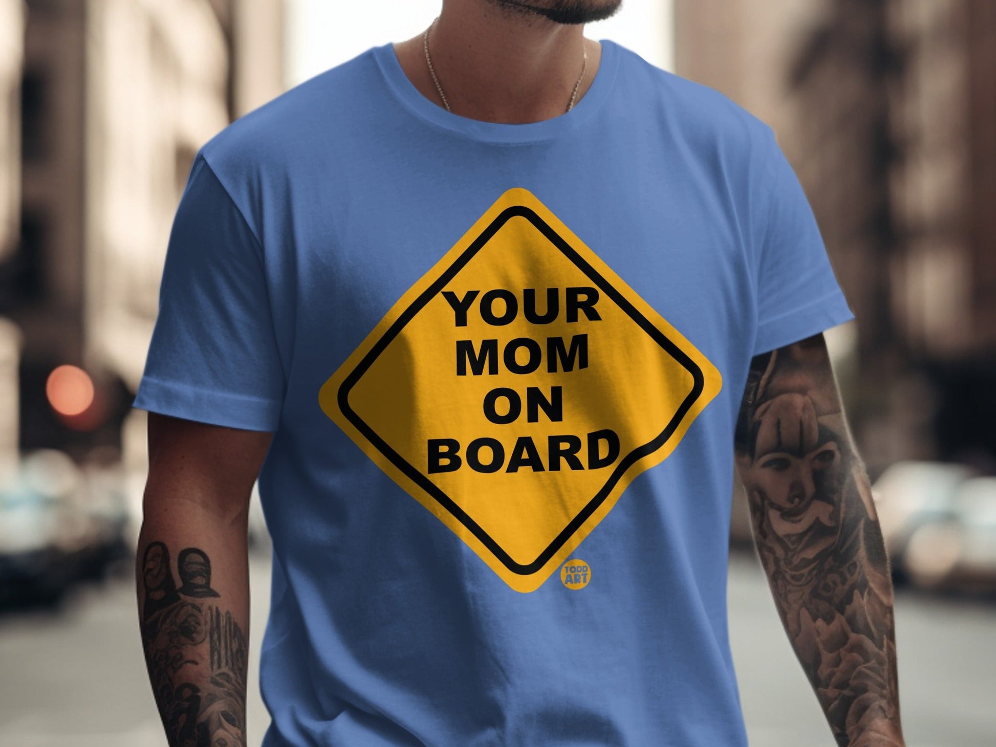Blue t-shirt with yellow diamond "Your Mom On Board" graphic.