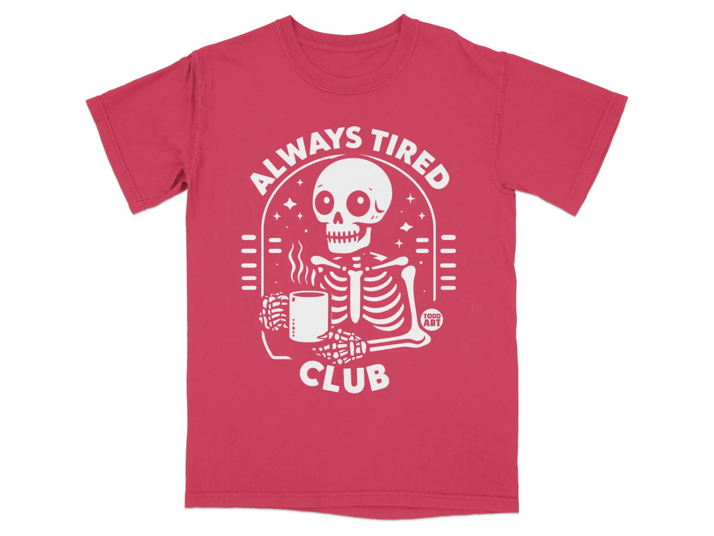 Red t-shirt with white graphic of a skeleton holding coffee, text "ALWAYS TIRED CLUB".