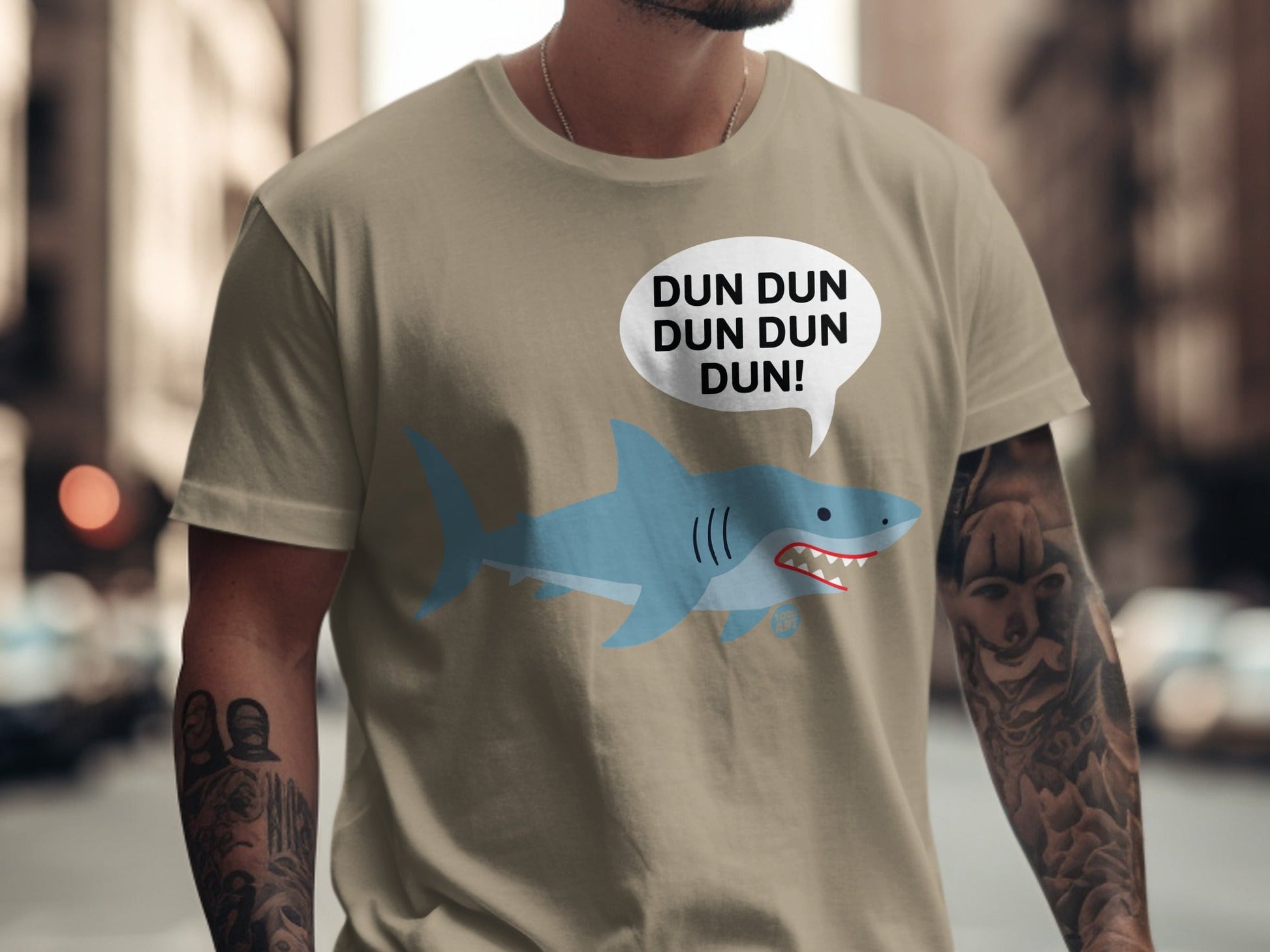 T-shirt with cartoon shark and "DUN DUN DUN DUN!" text bubble.