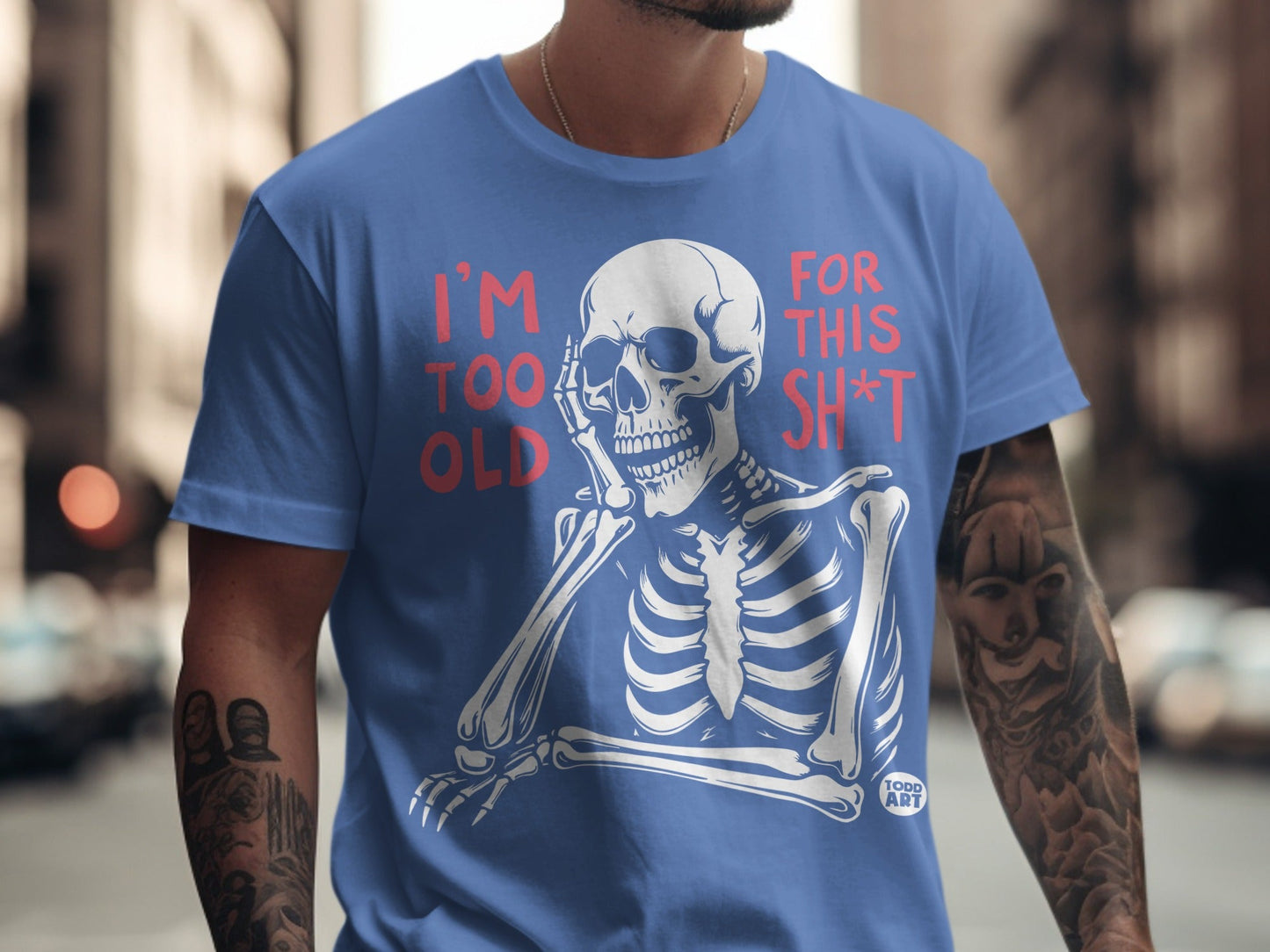 Blue t-shirt with skeleton graphic and text "I'M TOO OLD FOR THIS SH*T".