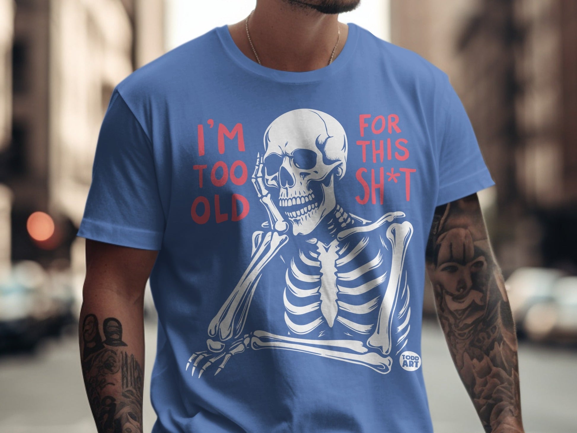 Blue t-shirt with skeleton graphic and text "I'M TOO OLD FOR THIS SH*T".