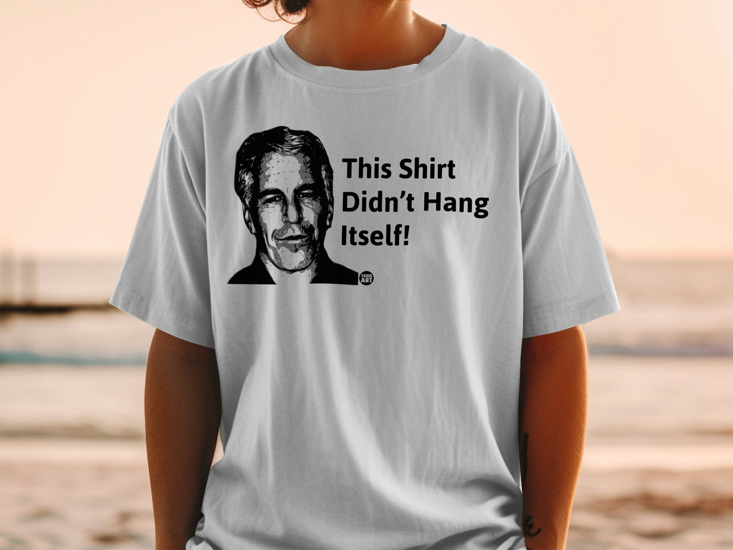 Gray t-shirt with portrait and text "This Shirt Didn't Hang Itself!"