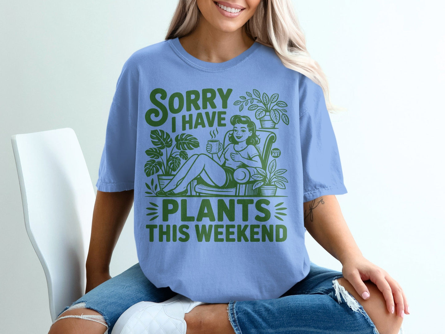 Blue t-shirt with green text "SORRY I HAVE PLANTS THIS WEEKEND" and illustrations.