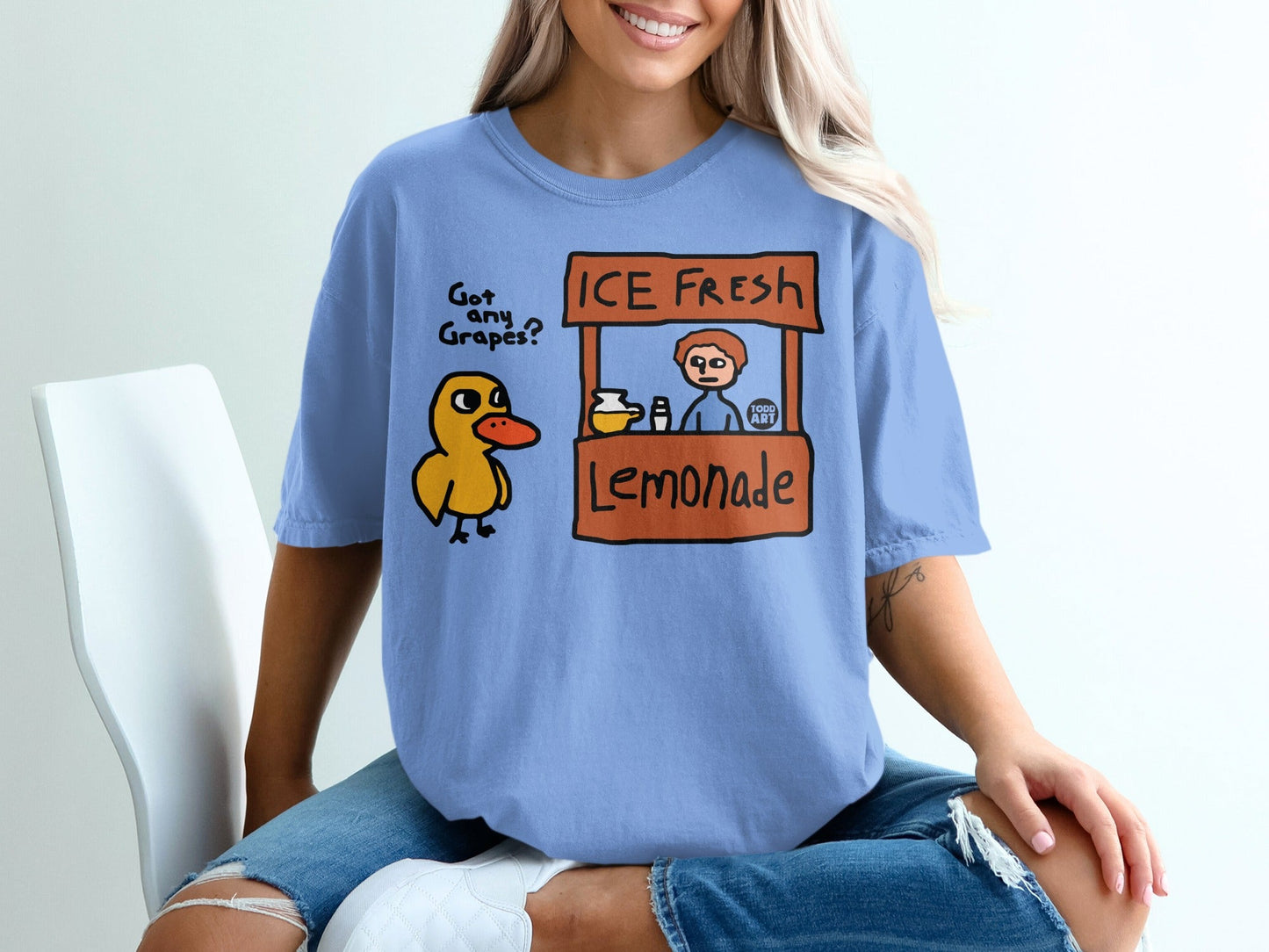 Duck at an ICE FRESH Lemonade stand with "Got Any Grapes?" text.
