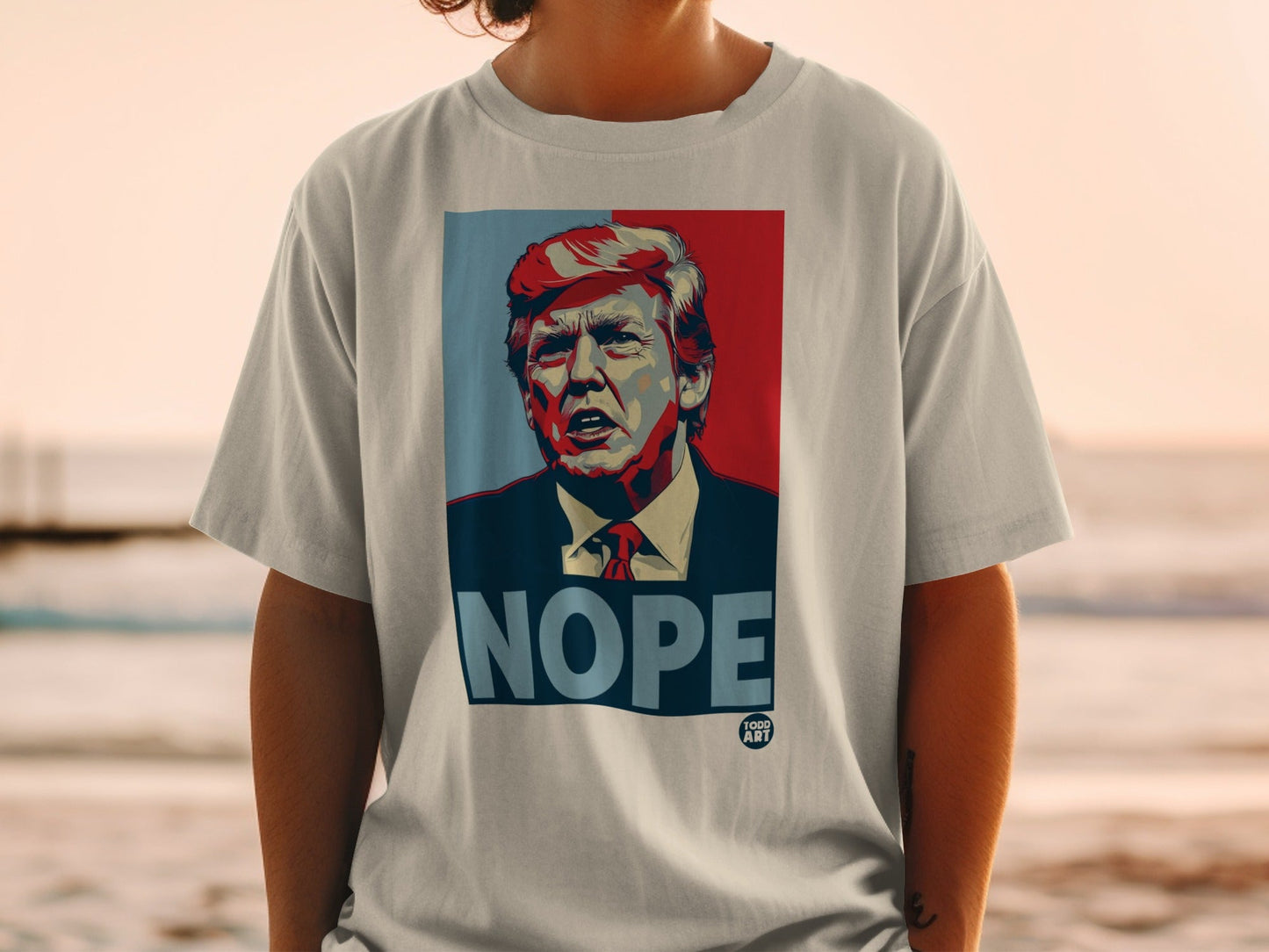 Donald Trump "Nope" graphic t-shirt with "100D ART" logo.