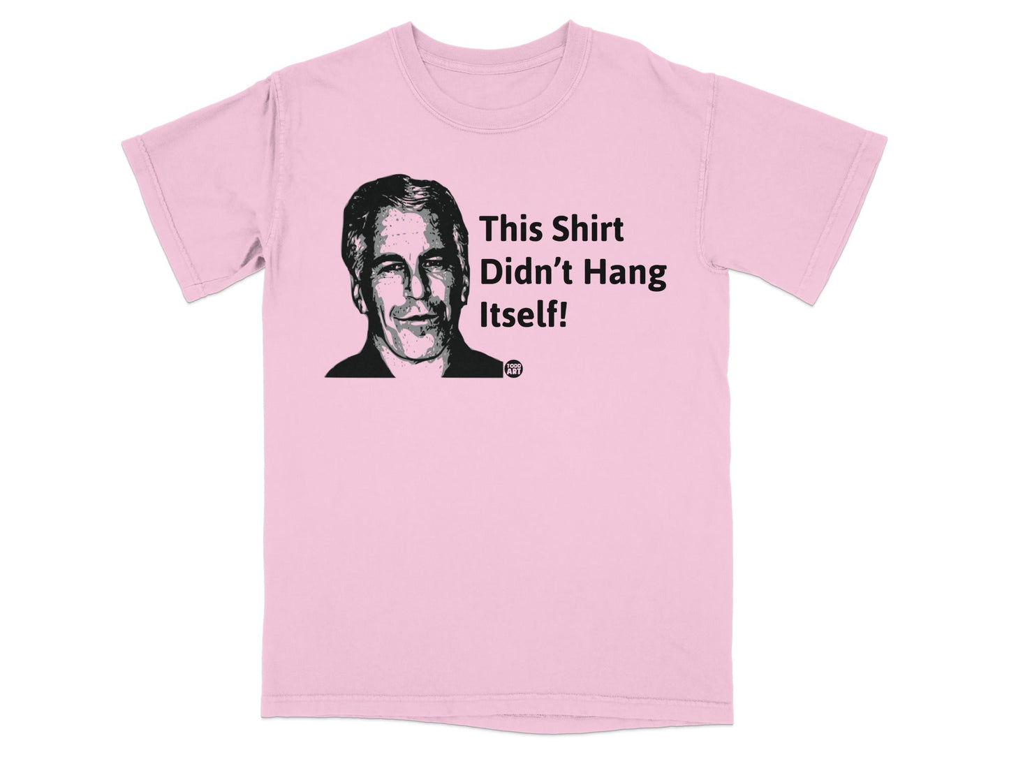Pink t-shirt with smiling man's head and text "This Shirt Didn't Hang Itself!"