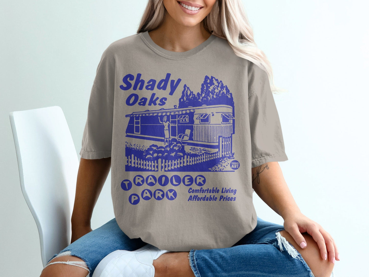 Shady Oaks Trailer Park graphic with trees, trailer, and fence.