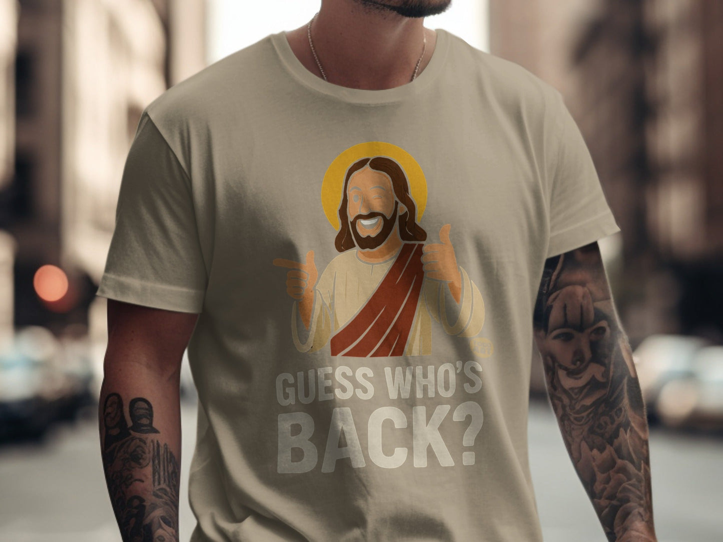 T-shirt with "Guess Who's Back?" and cartoon Jesus giving thumbs up.