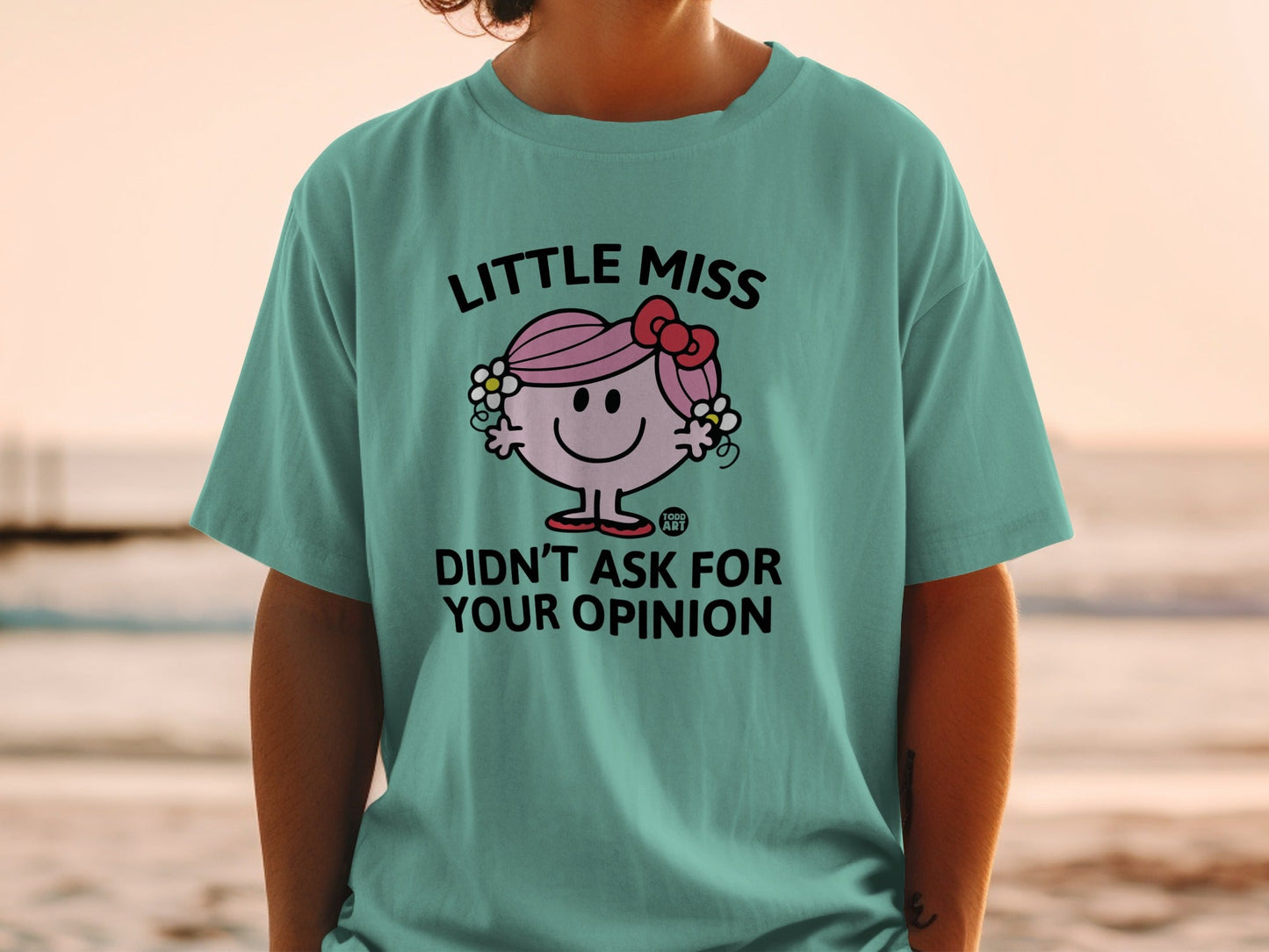 Teal t-shirt with Little Miss character saying "Didn't Ask For Your Opinion".