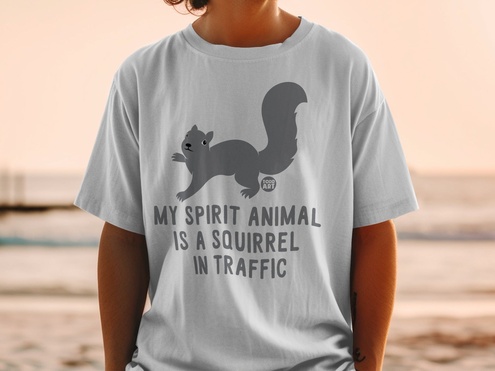 Gray t-shirt with squirrel graphic and text "MY SPIRIT ANIMAL IS A SQUIRREL IN TRAFFIC".
