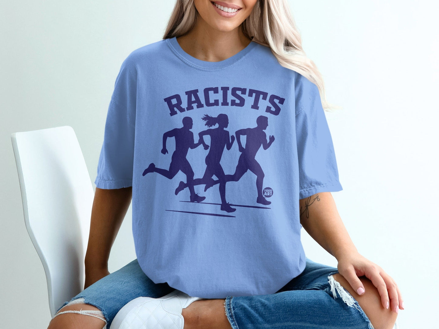 Blue t-shirt with "RACISTS" and running figures graphic.