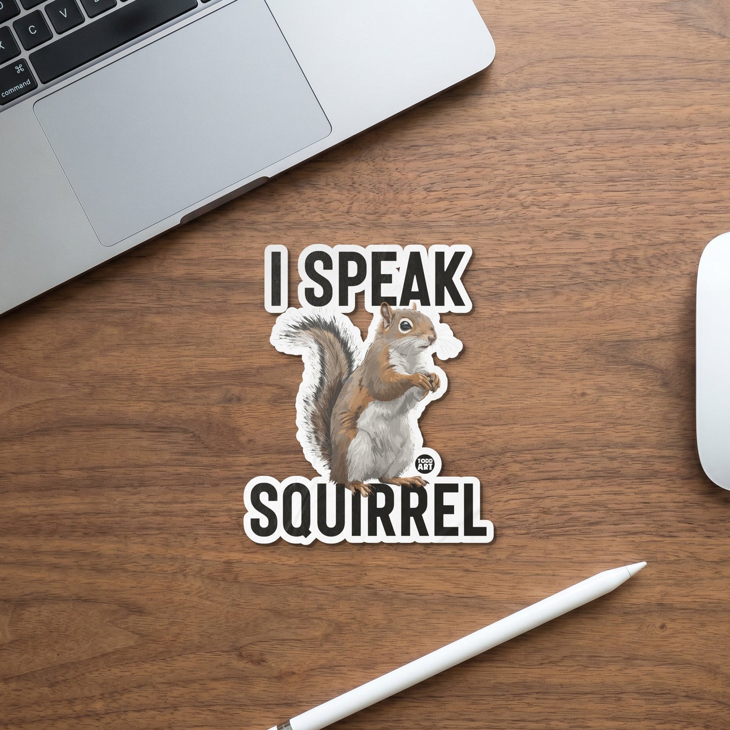 Sticker with "I SPEAK SQUIRREL" text and a drawing of a squirrel holding a nut.