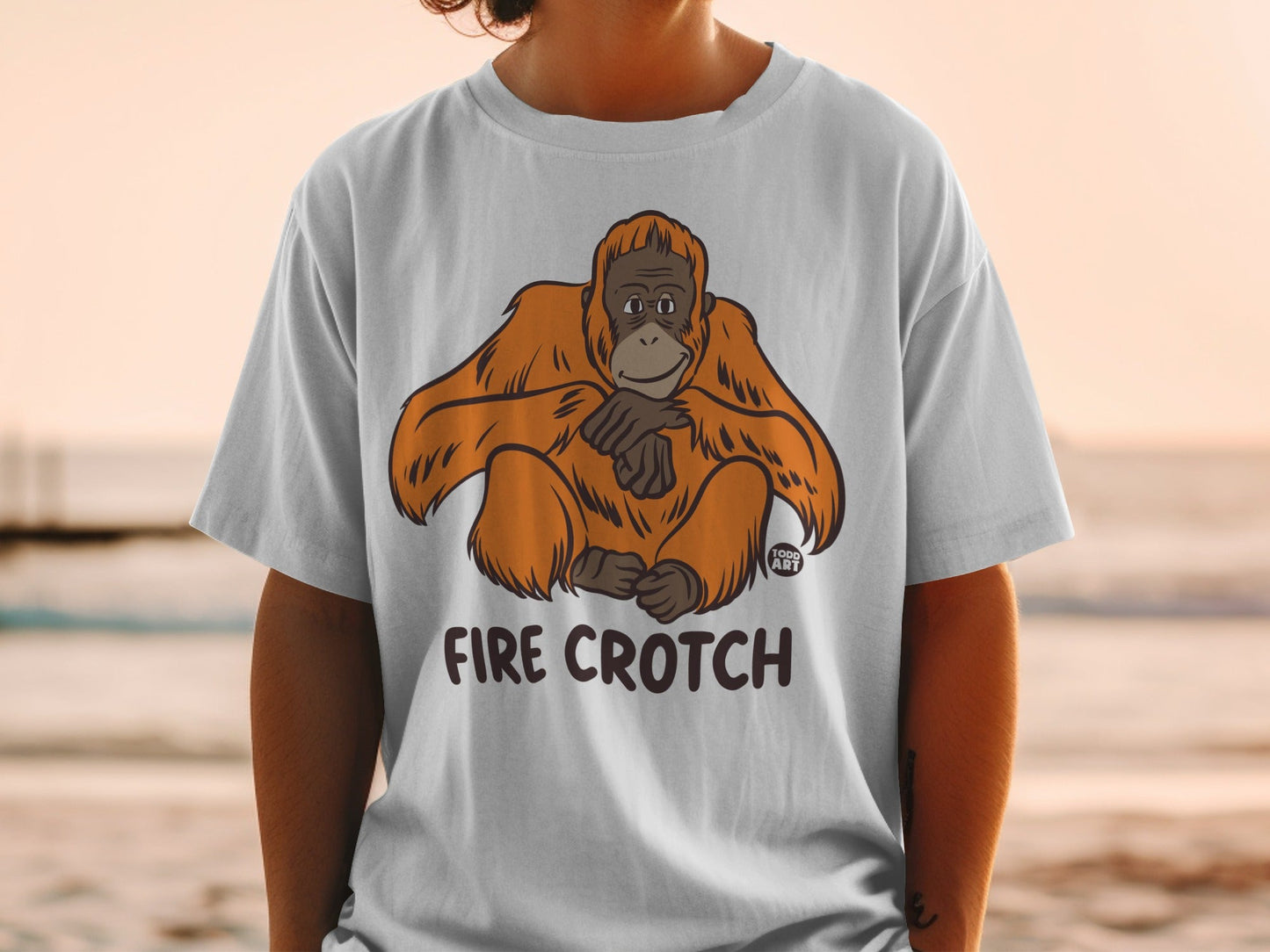 Light grey t-shirt with cartoon orangutan and "FIRE CROTCH" text.