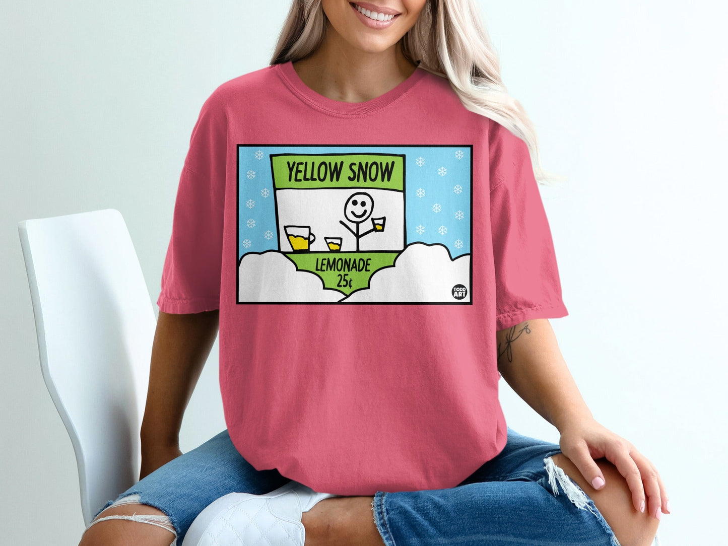 T-shirt graphic: Yellow Snow Lemonade sign with cups and snowflakes.